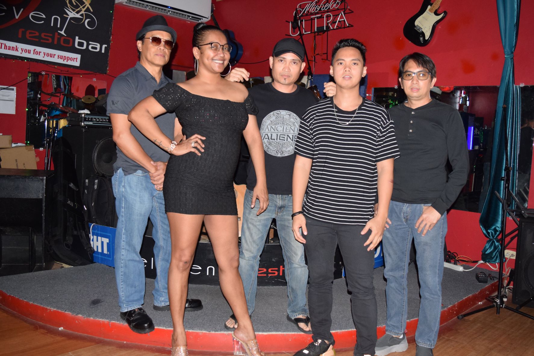 Groove Theory vocalists Jasmine Nabelgas, second left, and Anthony Reyes, second right, pose for a photo with bassist Reyel Contreras, left, drummer Dennis Morante, center, and lead guitarist Neil Capacio, right, at 9-Eleven Resto Bar.
