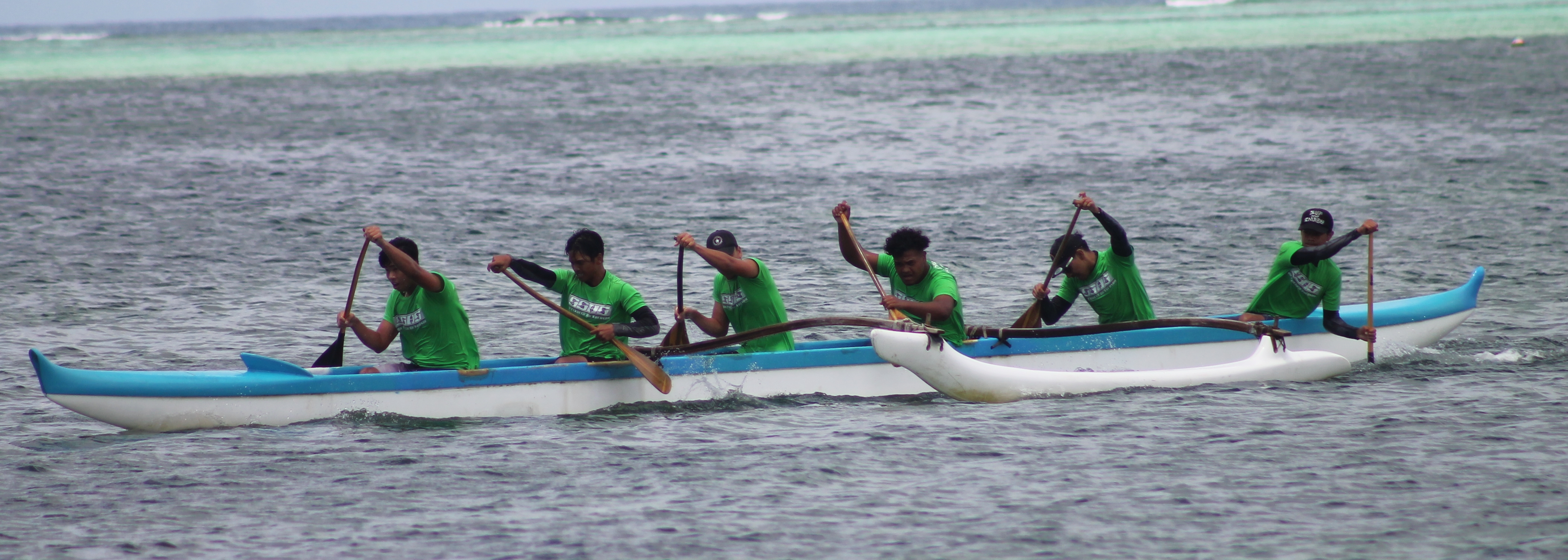 Saipan Southern High School's men's team pushes through in the 1000m final round of the PSS Interscholastic Outrigger Race Series on Saturday at Kilili Beach.