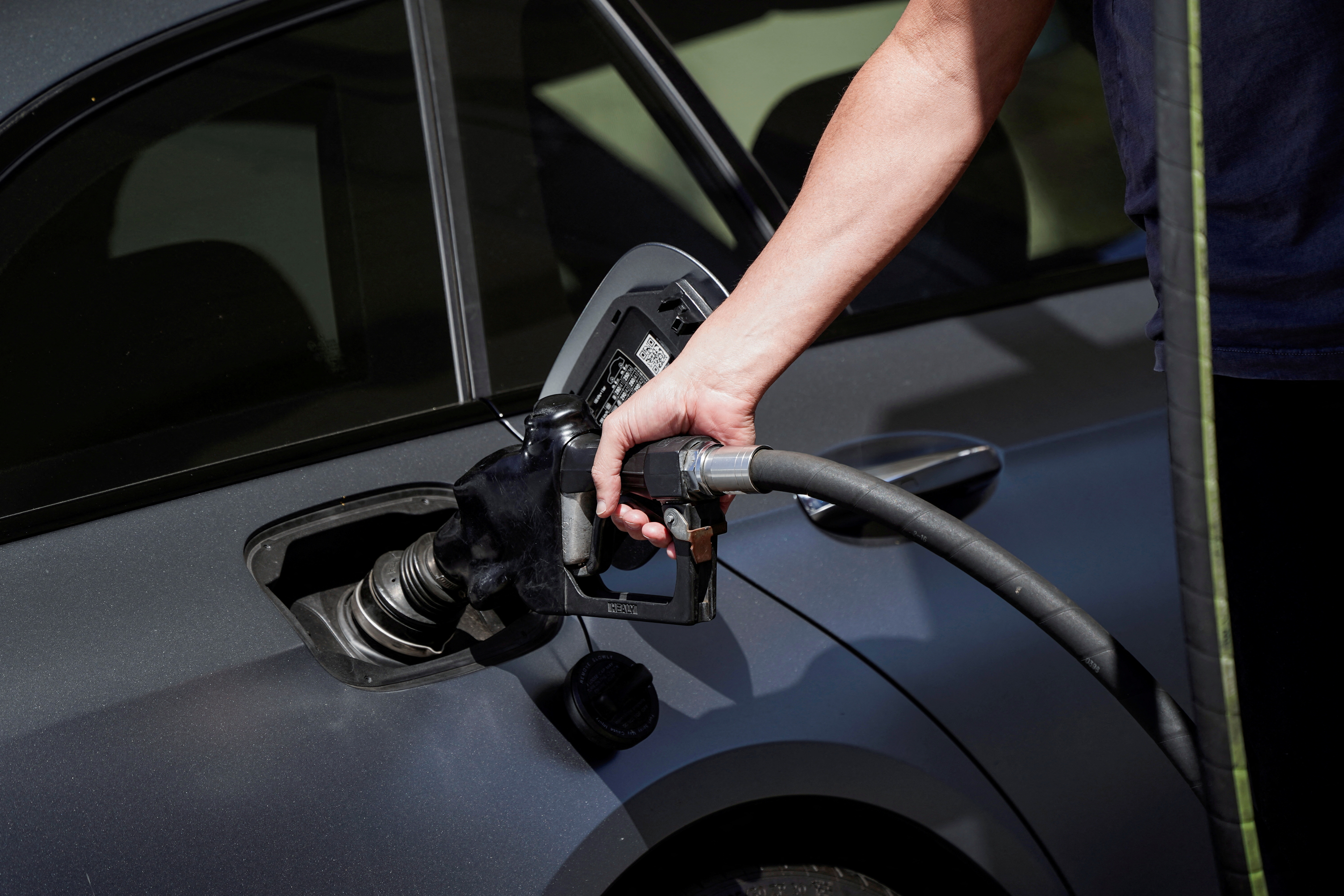 A customer refuels a vehicle at a Mobil gas station in Beverly Boulevard in West Hollywood, California, March 10, 2022.
