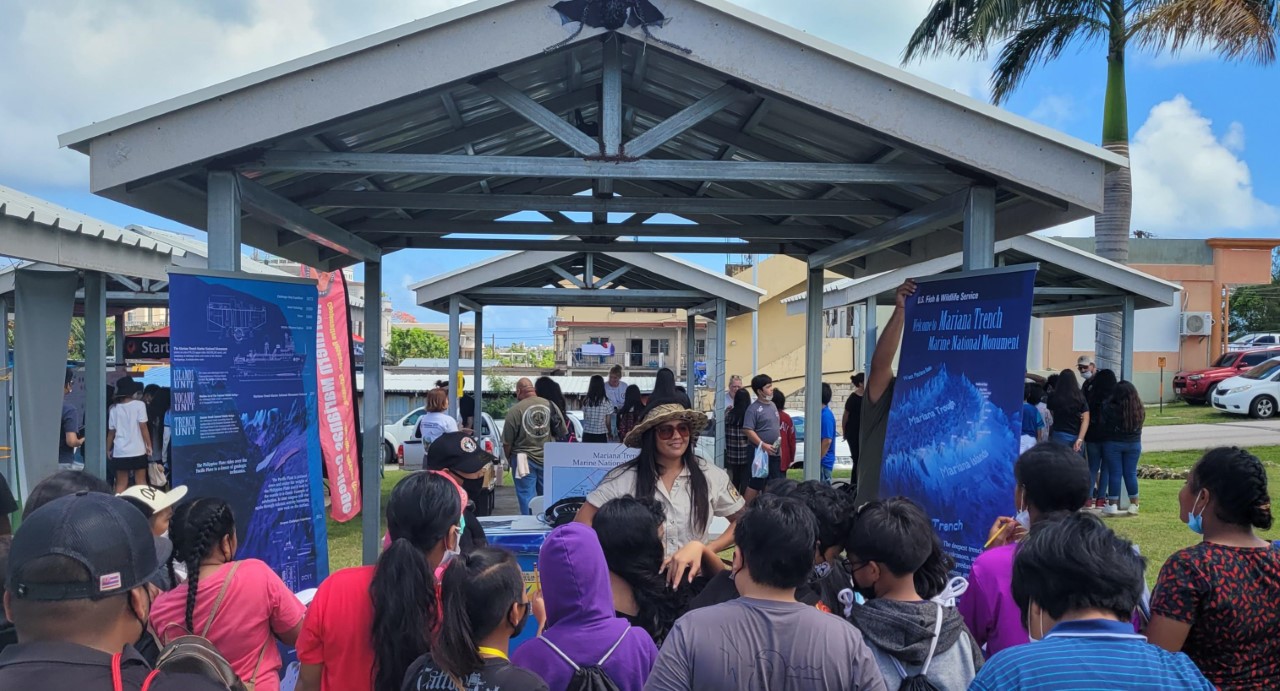 Students learn about the Marianas Trench Monument.