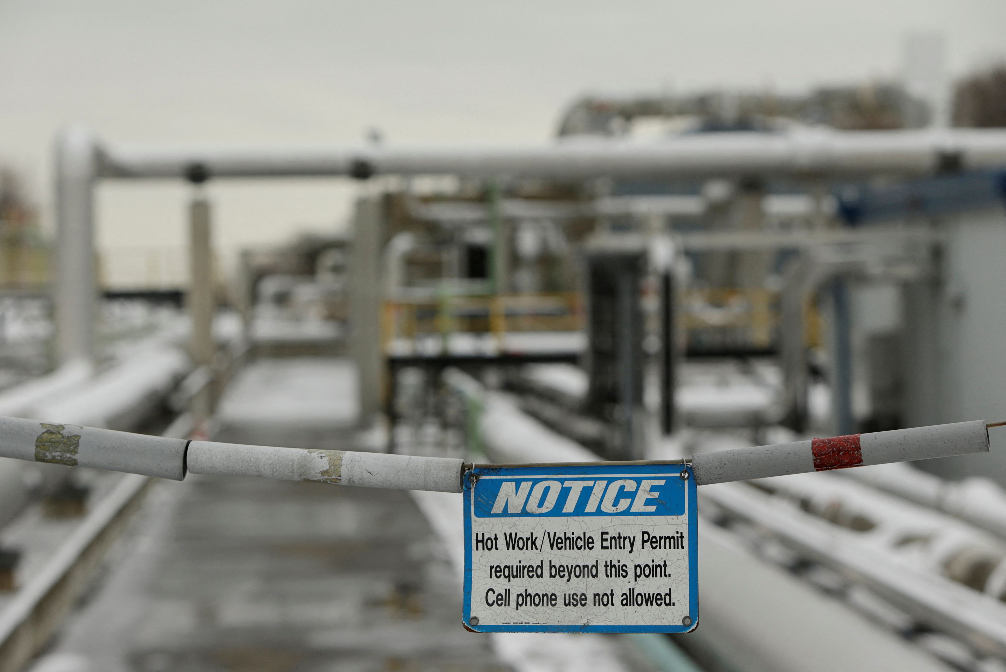 A  warning sign at the perimeter of a transfer line area is seen at the Dominion Cove Point Liquefied Natural Gas terminal in Lusby, Maryland on March 18, 2014.