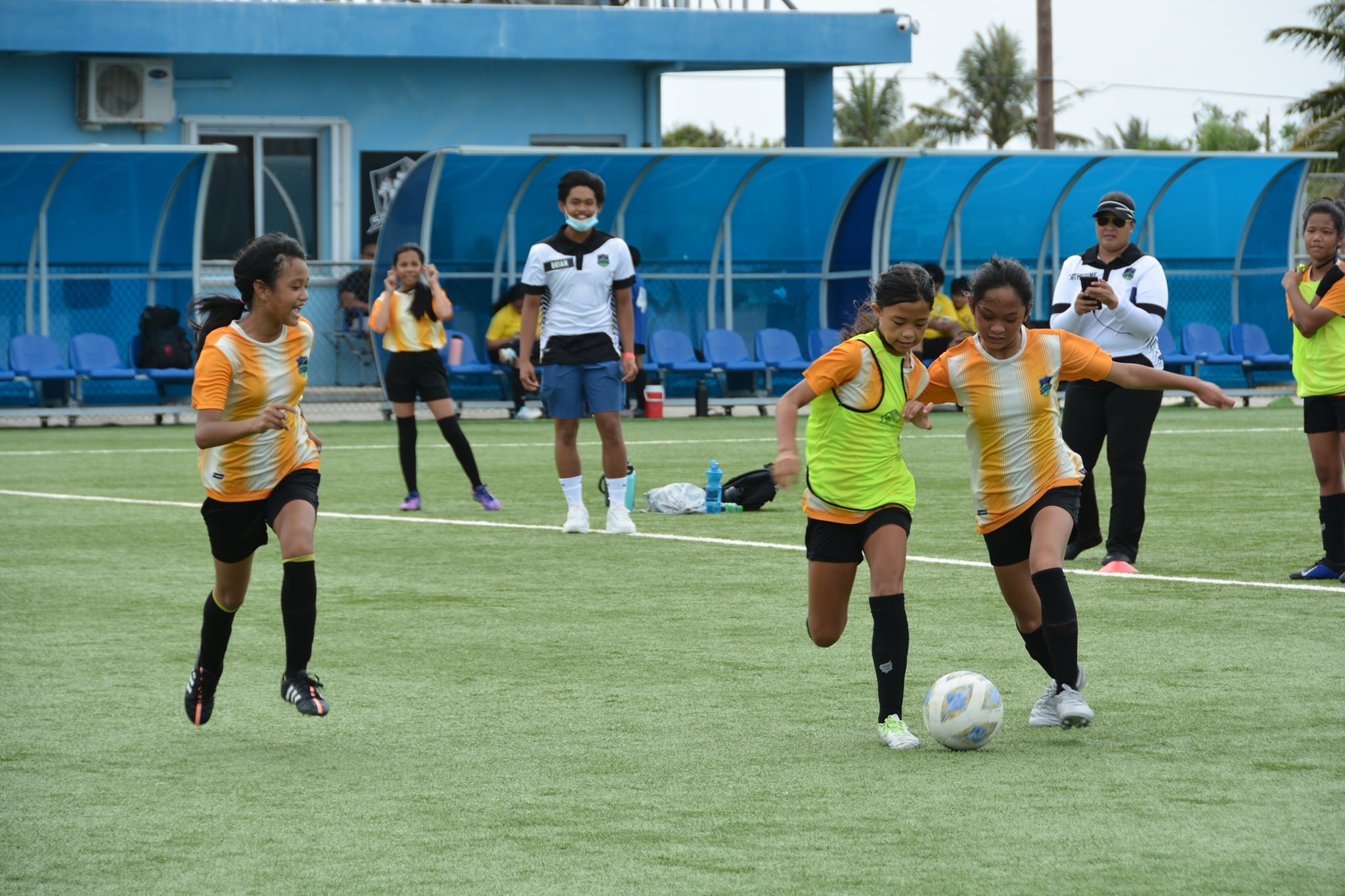 Kanoa  football clubs 1 and 2 battle for the possession during a U13 girls division game of the TakeCare Youth Soccer League Saturday at the NMI Soccer Training Center.
