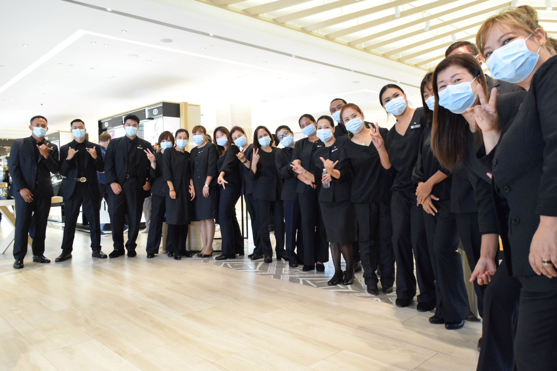 The sales staff members of T Galleria are ready for the store’s reopening.