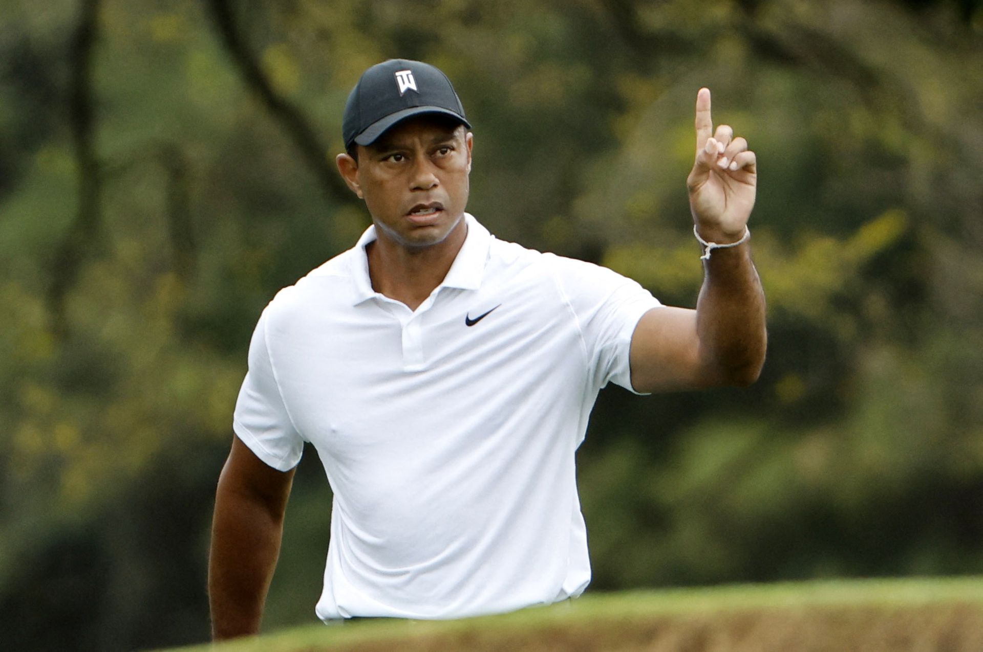 Tiger Woods reacts after his shot on the 18th during a practice round at the Augusta National Golf Club in Augusta, Georgia on April 6, 2022.
