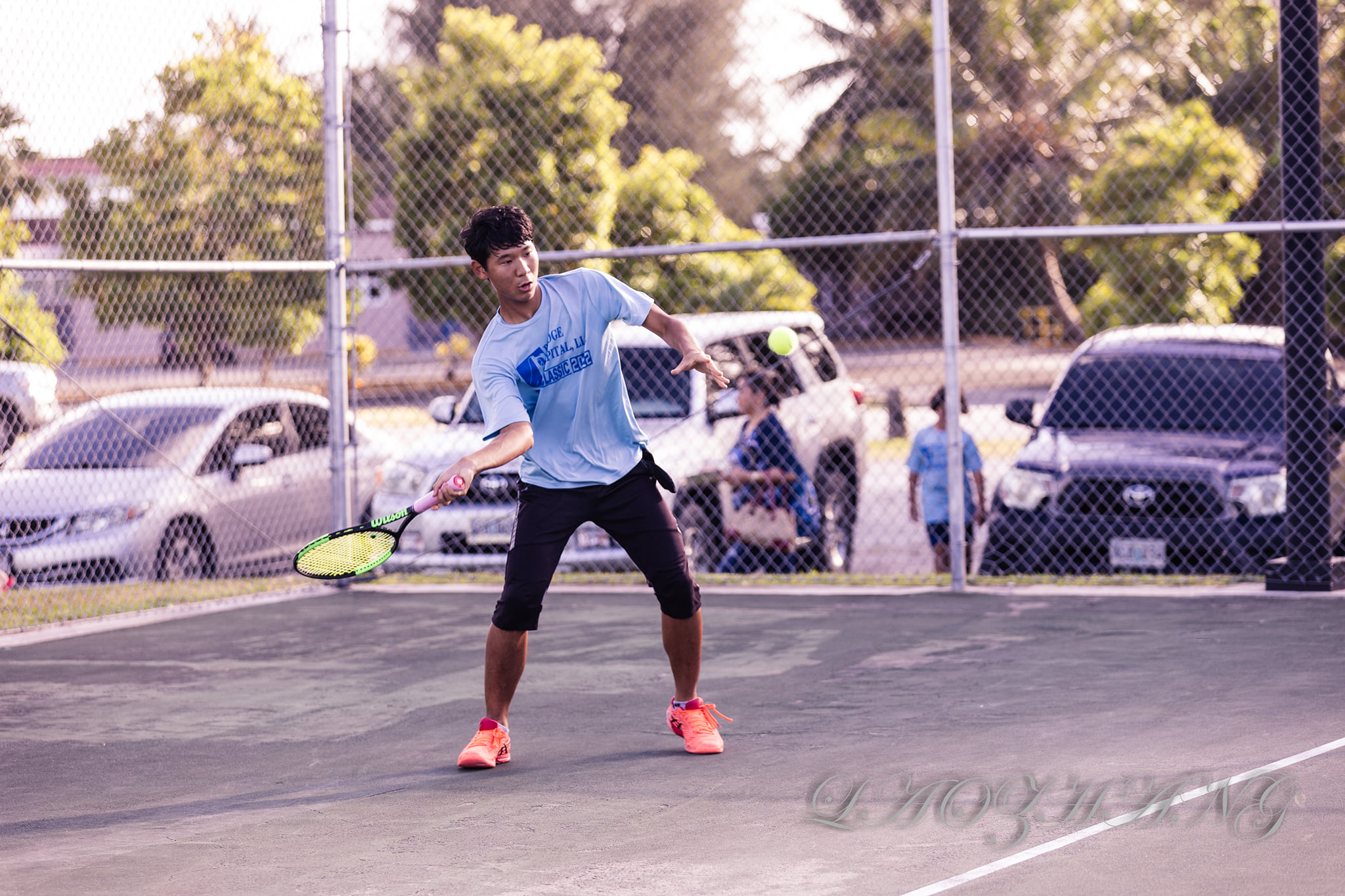 David Kwon attempts the front hand return during a Bridge Capital Tennis Classic match at an American Memorial Park tennis court over the weekend.