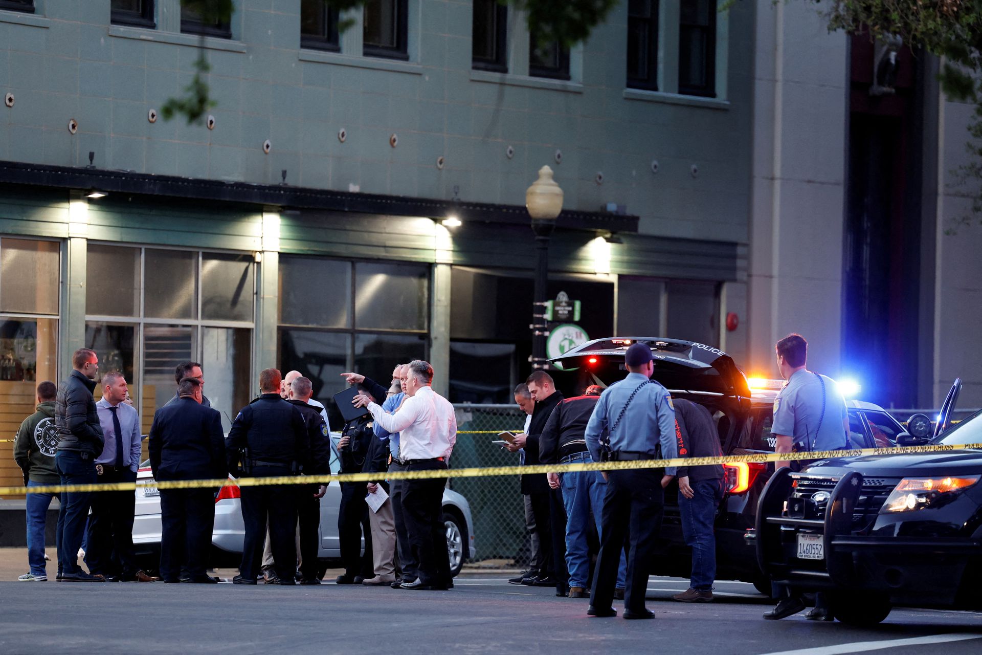 Police are seen after an early-morning shooting in a stretch of the downtown near the Golden 1 Center arena in Sacramento, California, April 3, 2022.