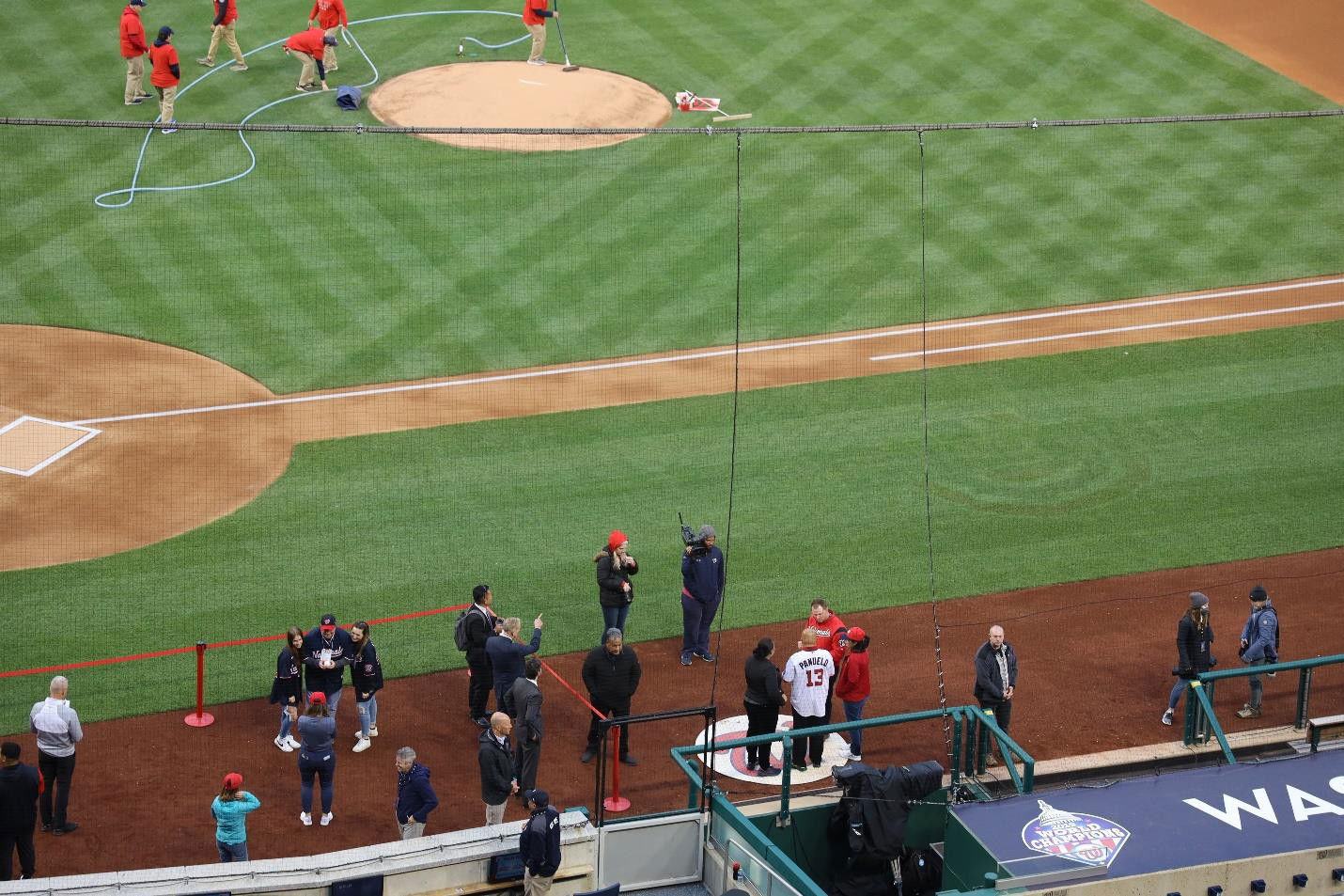 FSM President David  Panuelo, in jersey #13, meets with Washington Nationals staff prior to throwing the first pitch