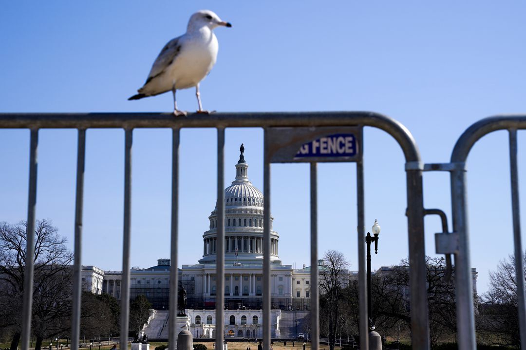 The U.S. Capitol is seen through a barricade prior to the arrival of several different convoys of truckers and other protestors headed to Washington, D.C. to protest Covid-19-related mandates and other issues on March 5, 2022.