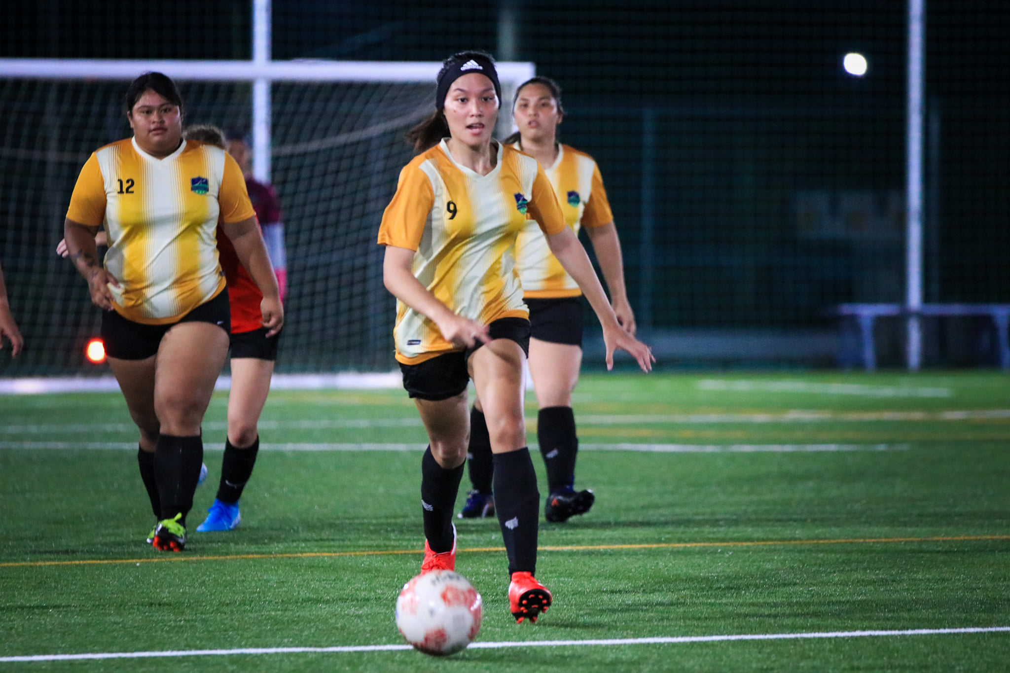 Kanoa's Hannah Santos pushes forward during a Flores-Pee Luwal or Intermediate Division game of the Dove Women’s League at the NMI Soccer Training Center.