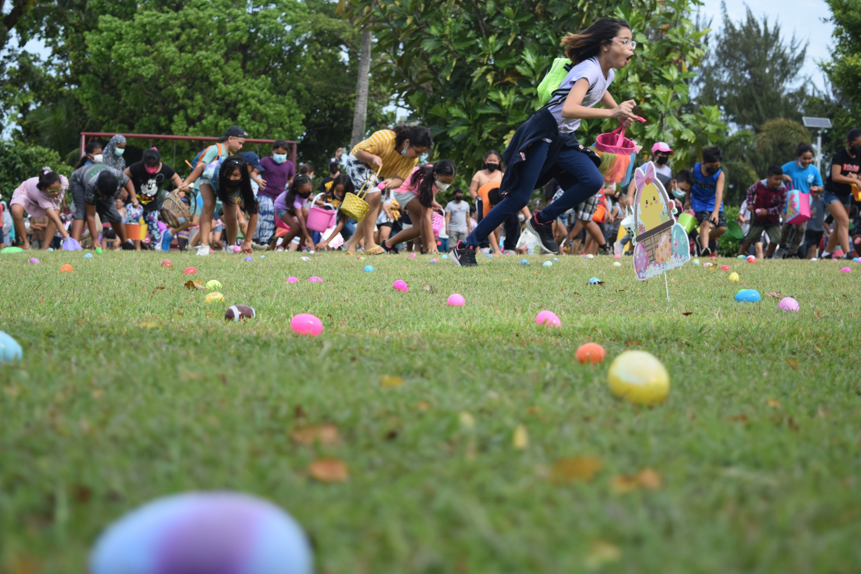 Children rush to pick up Easter eggs during the Rotary Club of Saipan's Community Egg-Stravaganza Easter egg hunt at Sugar King Park in Garapan on Saturday.