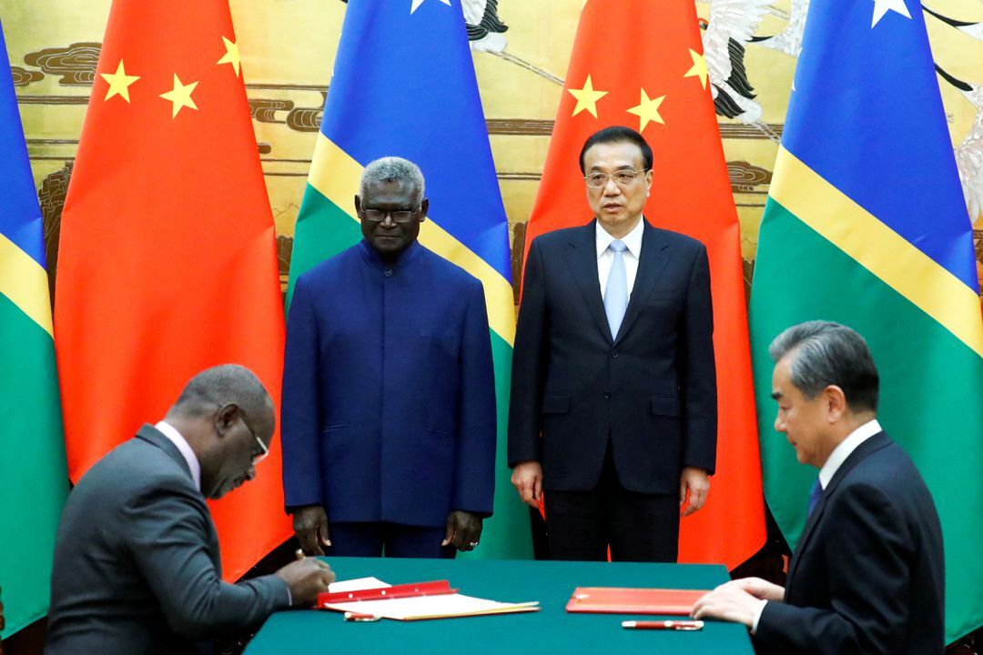 Solomon Islands Prime Minister Manasseh Sogavare, Solomon Islands Foreign Minister Jeremiah Manele, Chinese Premier Li Keqiang and Chinese State Councillor and Foreign Minister Wang Yi attend a signing ceremony at the Great Hall of the People in Beijing, China on October 9, 2019.