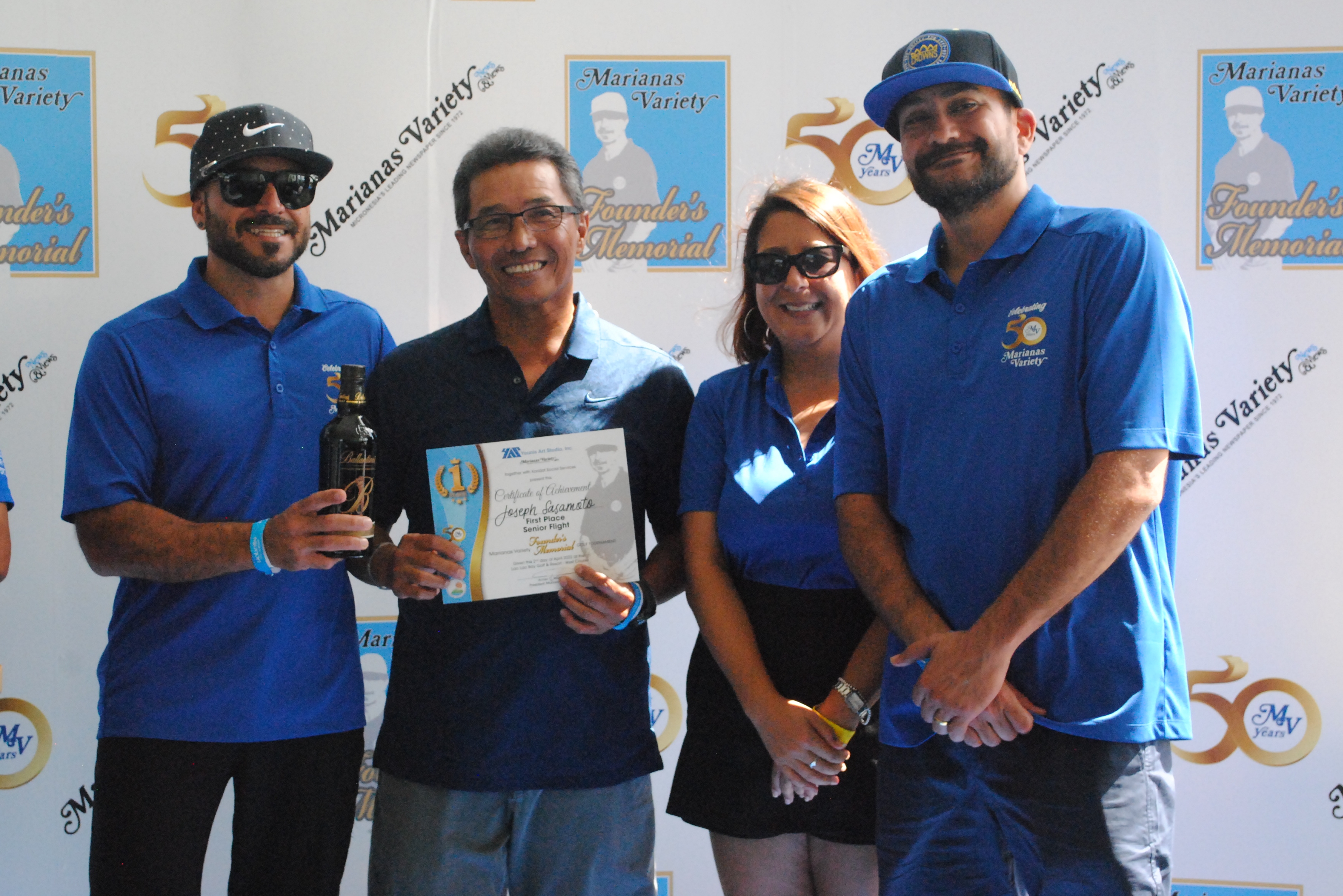 Joseph Sasamoto, 2nd left, poses with Marianas Variety President Amier Younis, left, and siblings Farah Younis, 2nd right, and Salam Younis during the awards ceremony of the MV Founder's Memorial Golf Tournament at Laolao Bay Golf & Resort on Saturday.