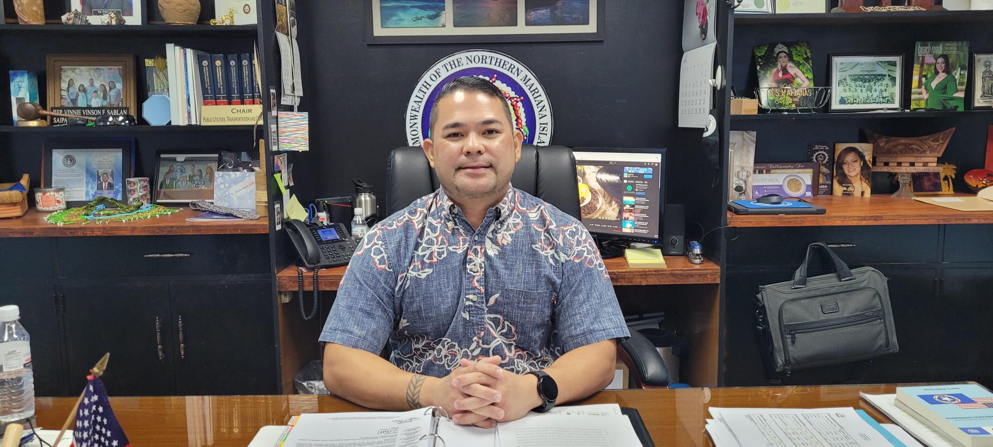 Senate Floor Leader Vinnie F. Sablan poses for a photo in his office at the legislative building.