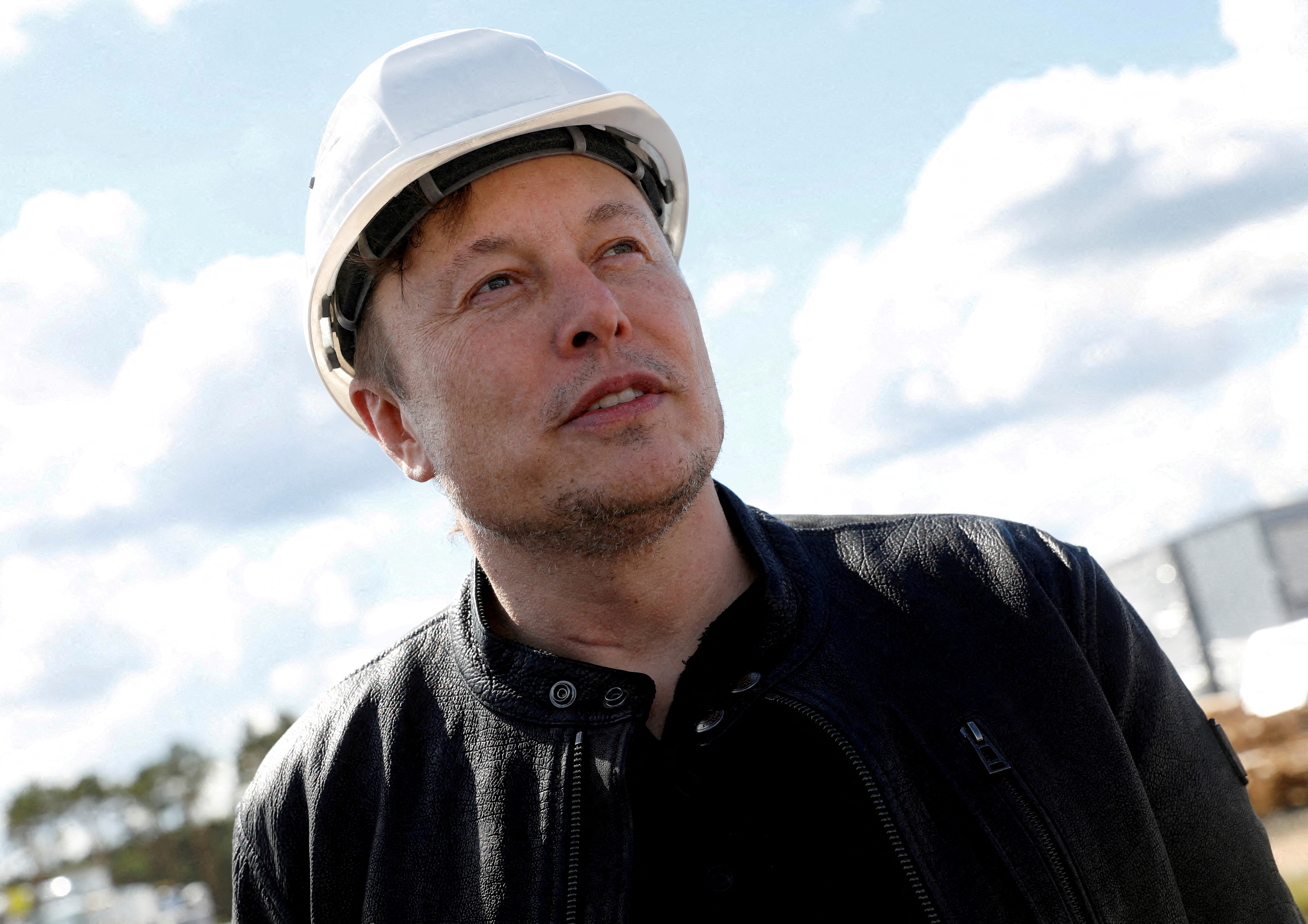 Tesla CEO Elon Musk looks on as he visits the construction site of Tesla's gigafactory in Gruenheide, near Berlin, Germany, May 17, 2021.