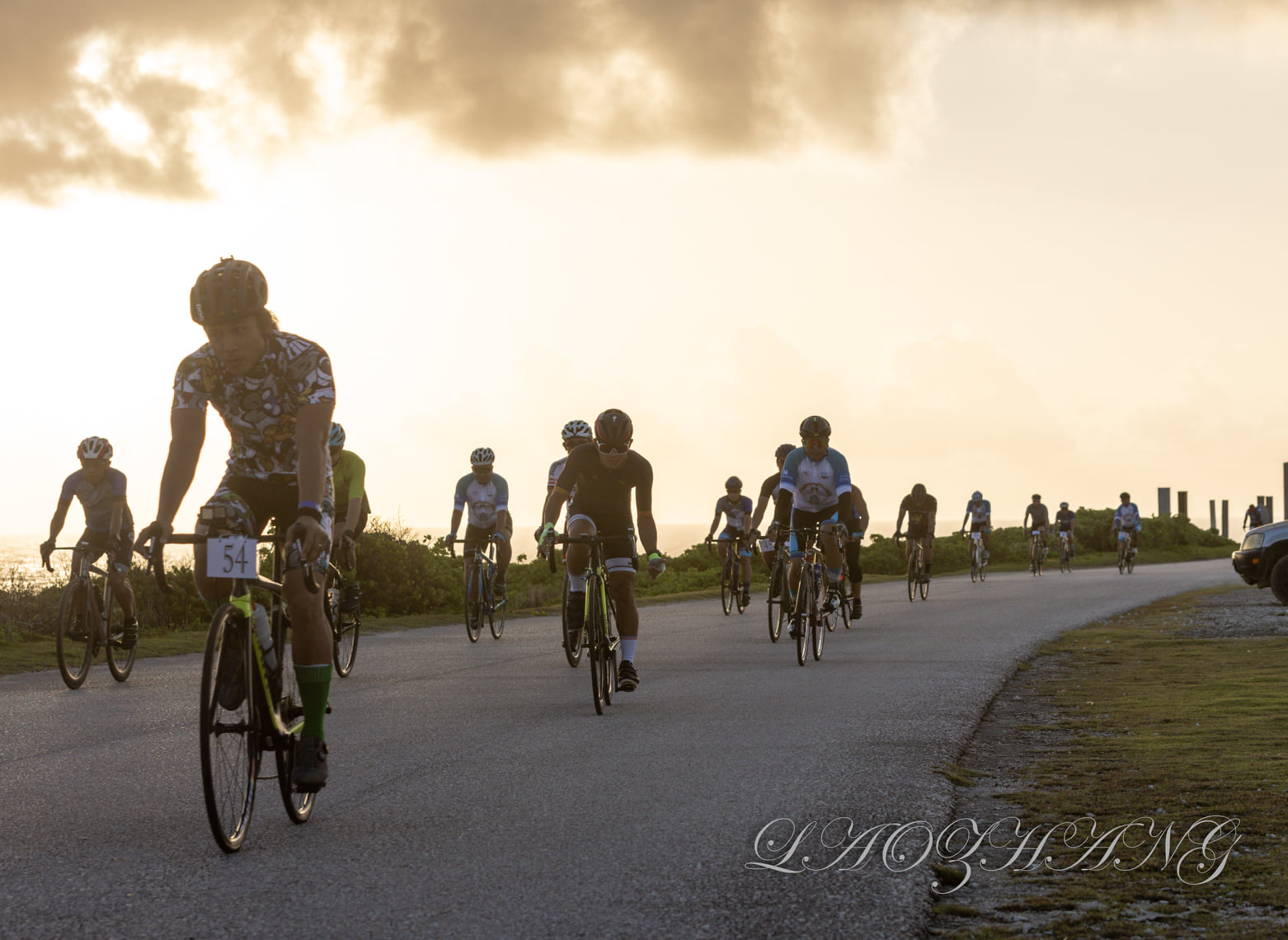 Joel Buco, center, and other bikers take off at the start of the Saipan Unity Lions Club 6th Annual Bike Race Sunday at Banzai Cliff.