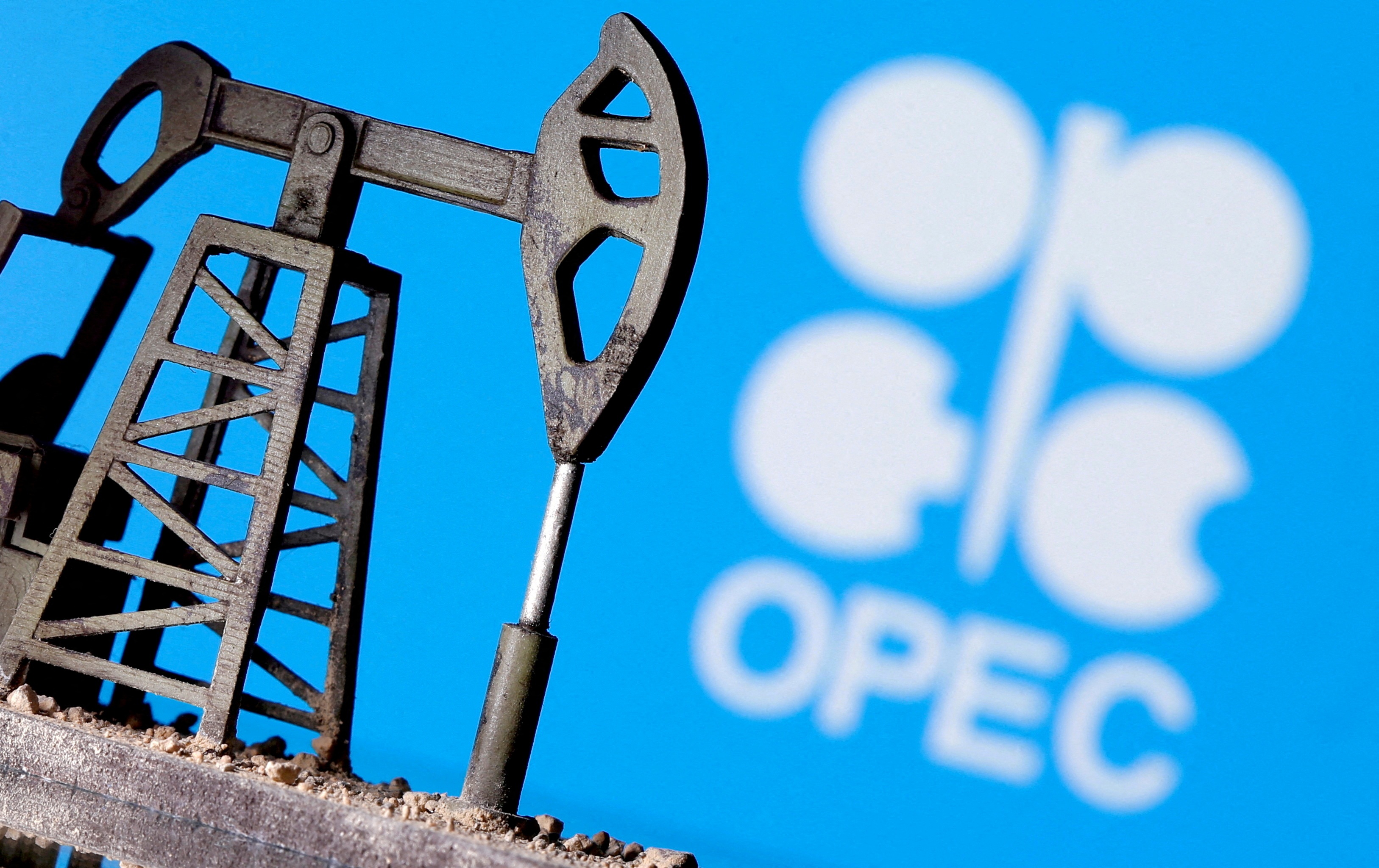 A 3D-printed oil pump jack is seen in front of displayed OPEC logo in this illustration picture, April 14, 2020.
