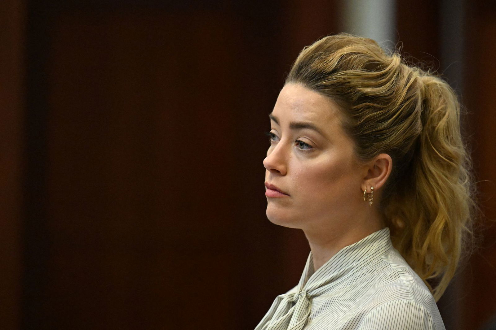 Amber Heard attends trial at the Fairfax County Circuit Courthouse as the defamation case brought against her by her ex-husband Johnny Depp continues, in Fairfax, Virginia, April 19, 2022.