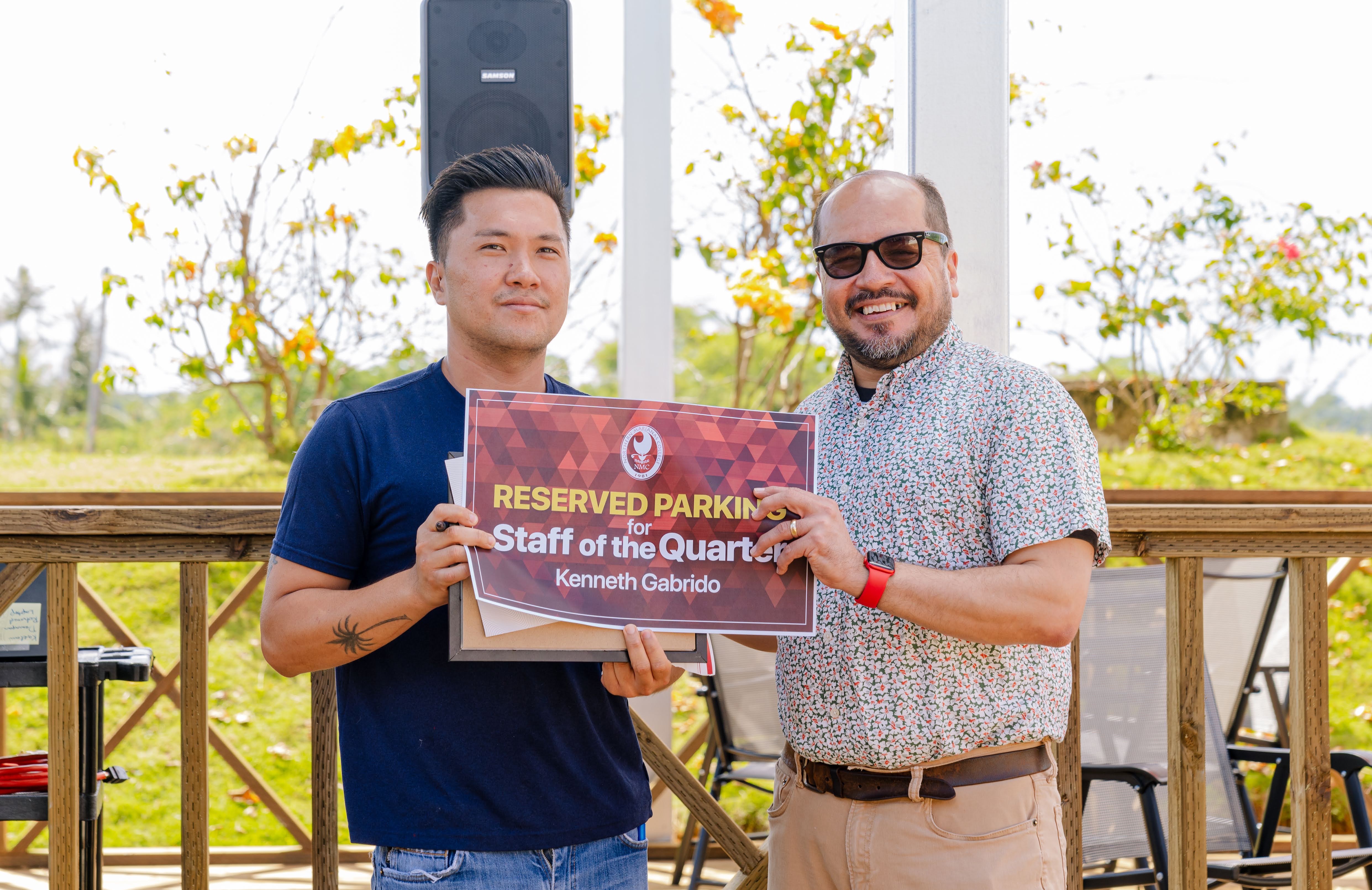 NMC Staff of the Quarter awardee Kenneth Gabrido, left, with NMC President Galvin Deleon Guerrero, EdD.