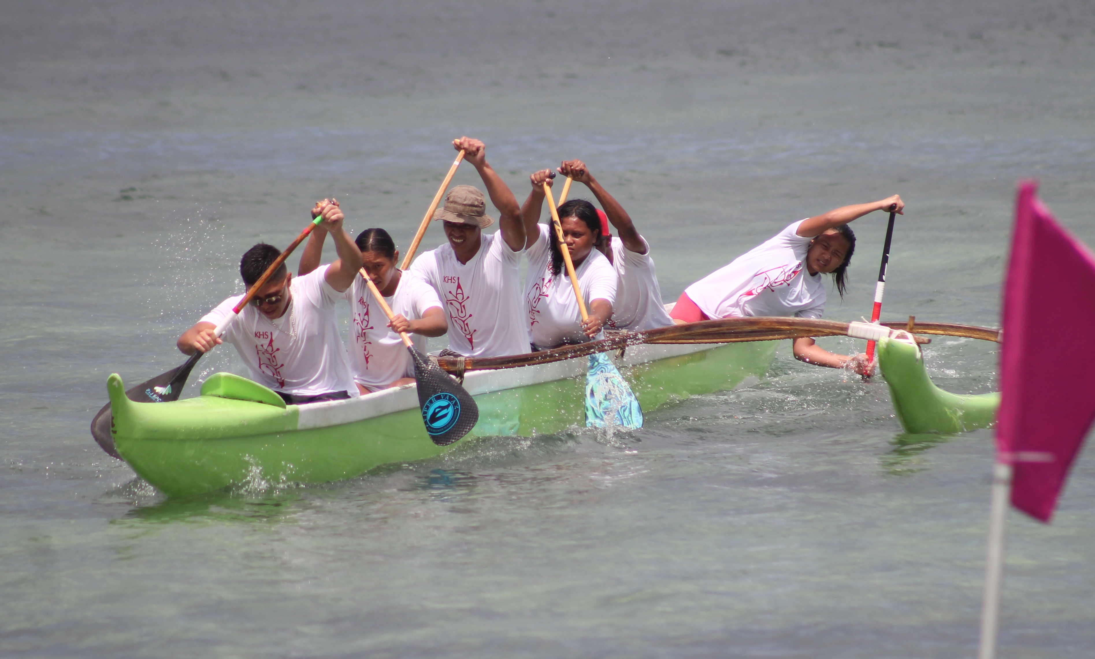 Kagman High School’s coed team attempts a turn during the 1000m event of the PSS Interscholastic Outrigger Race Series on Saturday at Kilili Beach.