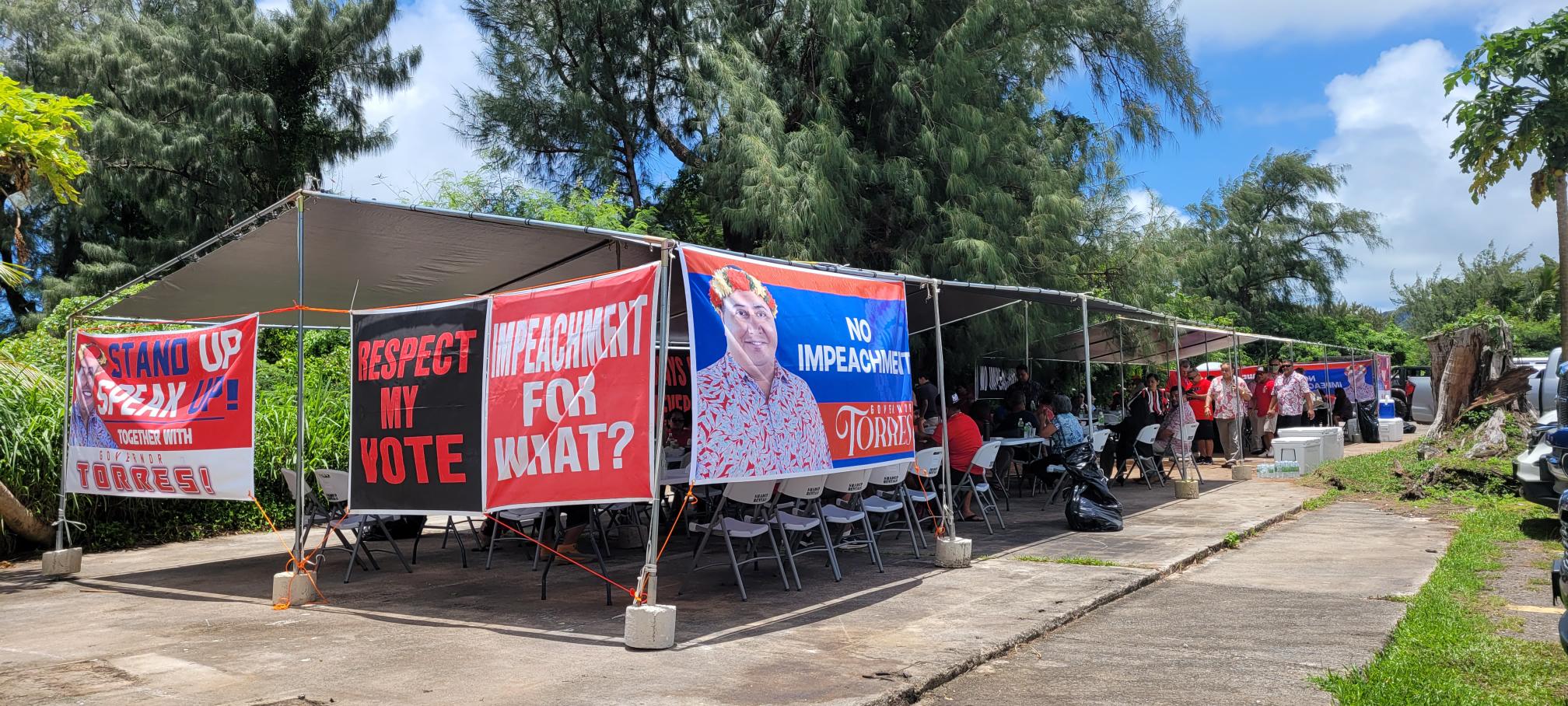 Supporters of Gov.  Ralph DLG Torres set up camp outside the legislative building on Tuesday.