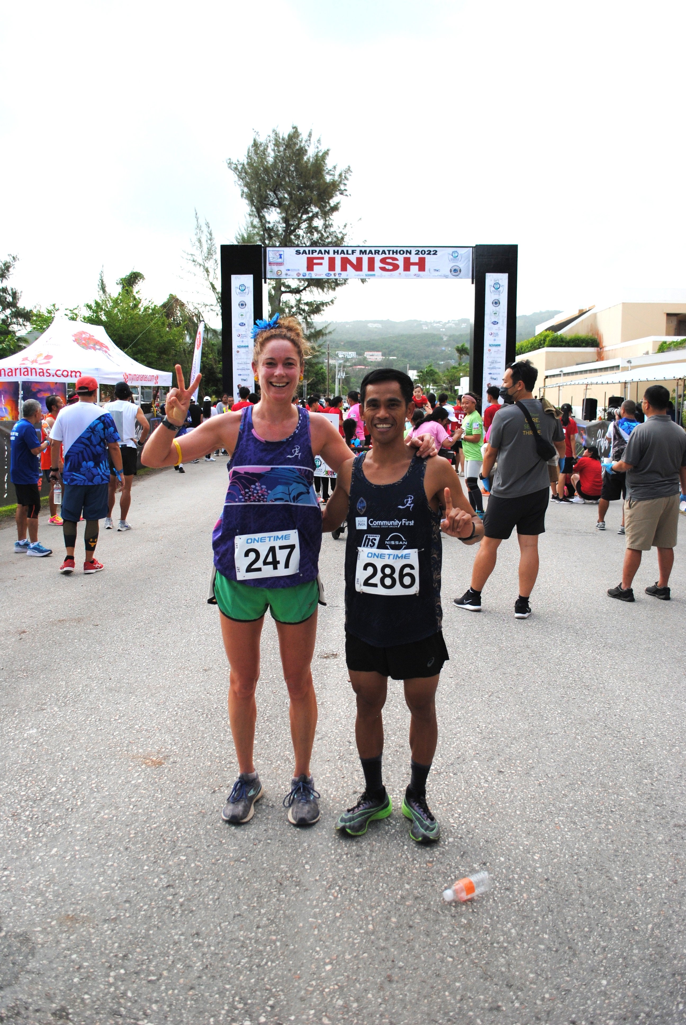 Lily Muldoon and Ryan Matienzo pose after completing the Saipan Half Marathon at American Memorial Park on Saturday.