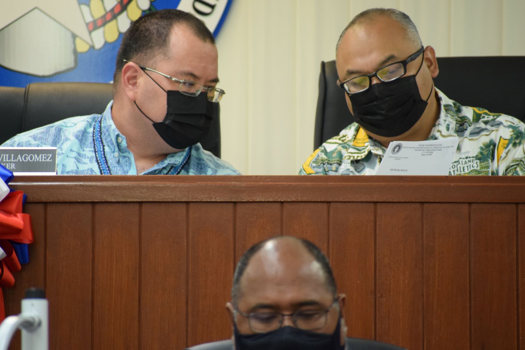 Speaker Edmund S. Villagomez and Vice Speaker Blas Jonathan Attao review a document during  House session earlier this week. Also in photo: House legal counsel Joseph L.G. Taijeron