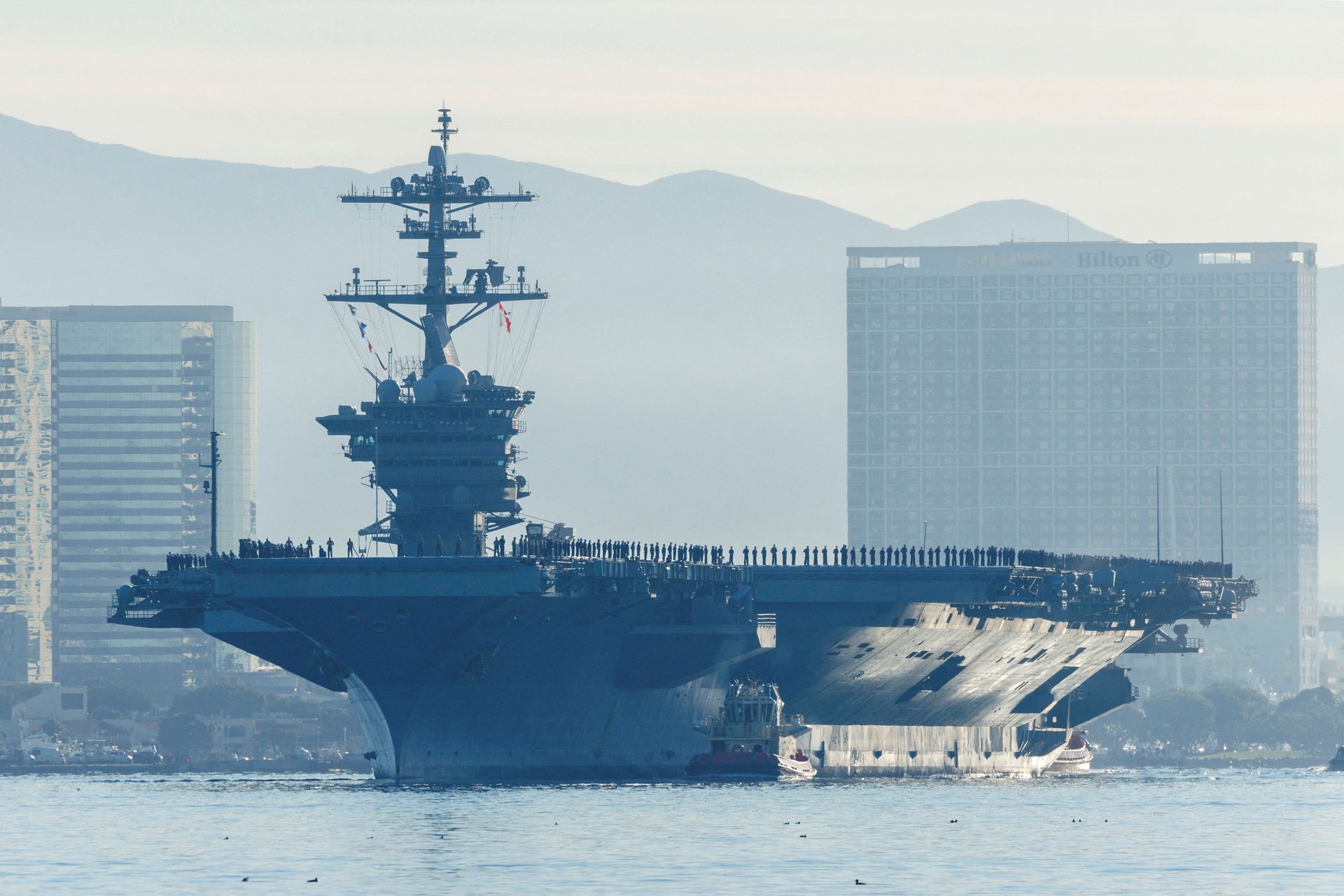 The USS Abraham Lincoln deploys from San Diego Naval Air Station North Island in San Diego, California on Jan. 3, 2022.