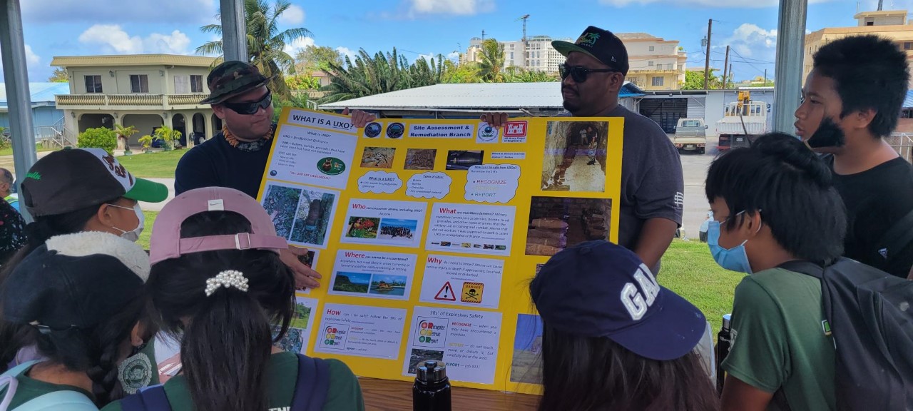 Students learn unexploded ordnance safety.