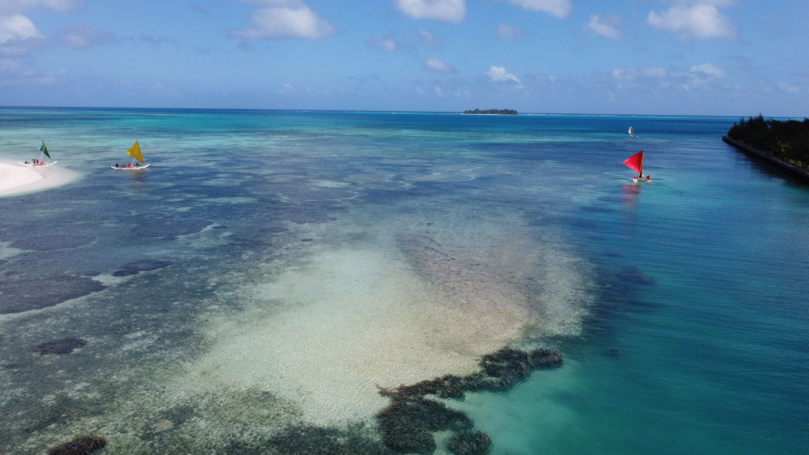 The sailing canoes begin their voyage around Saipan on Sunday