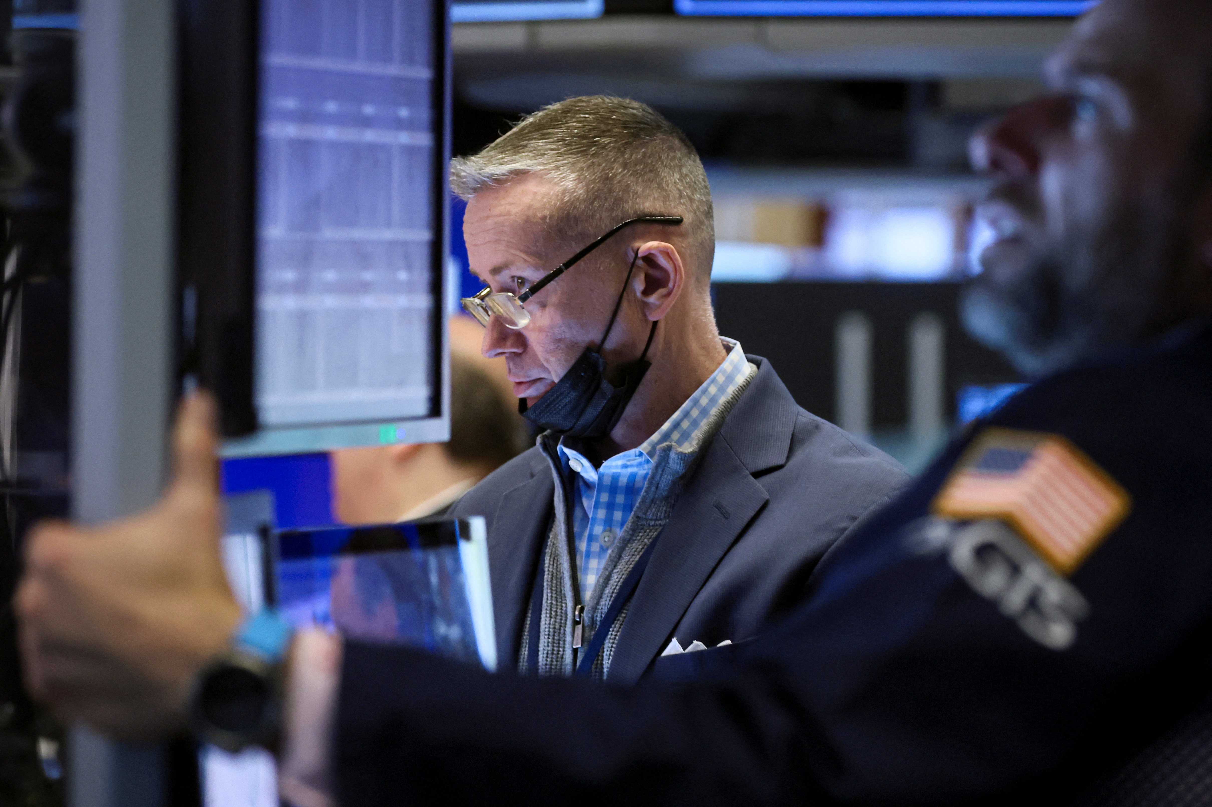 Traders work on the floor of the New York Stock Exchange in New York City, April 14, 2022.