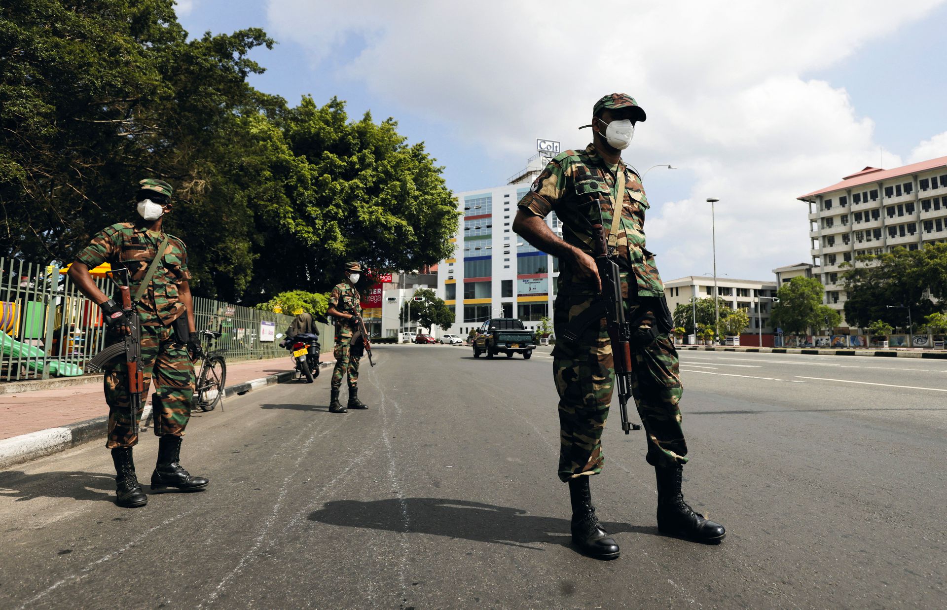 Sri Lankan army soldiers stand guard at a checkpoint after the government imposed a curfew following a clash between police and protestors near Sri Lankan President Gotabaya Rajapaksa's residence during a protest last Thursday, amid the country's economic crisis, in Colombo, Sri Lanka on April 3, 2022.