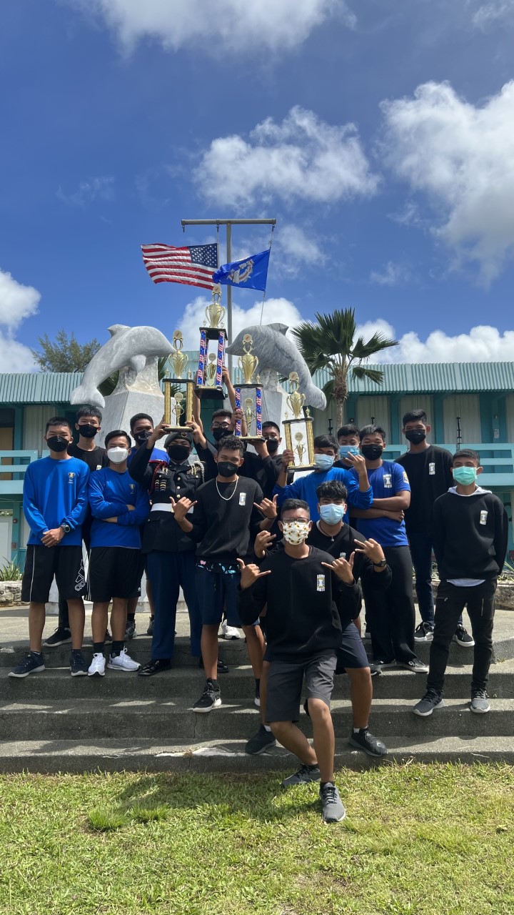 The Marianas High School Dolphin Battalion armed team members pose for a photo with their trophies.