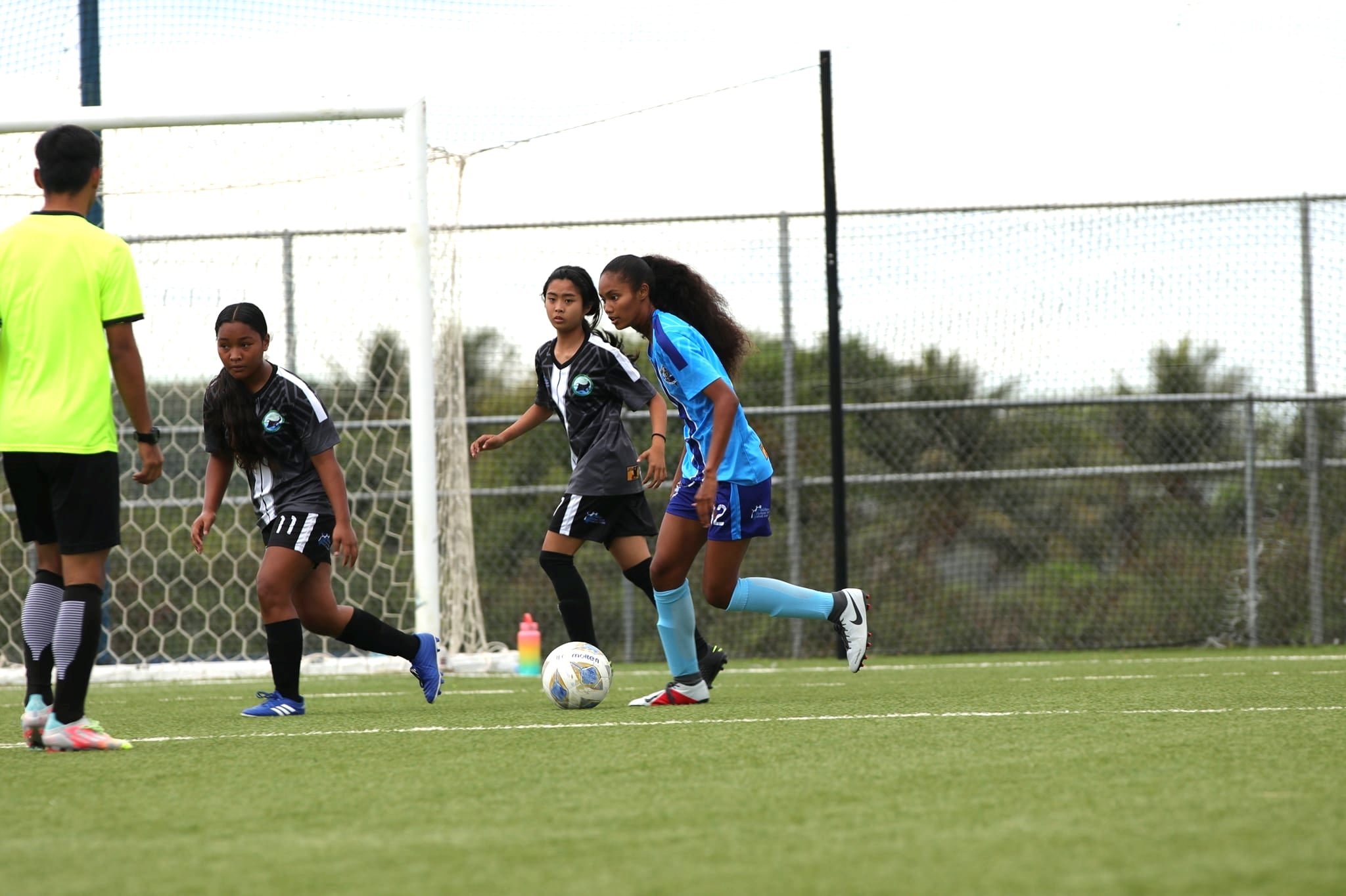 Tamia Kileleman-Hix sets up the play during a girls high school division game of the NMIFA-PSS Interscholastic Soccer League at the NMI Soccer Training Center.