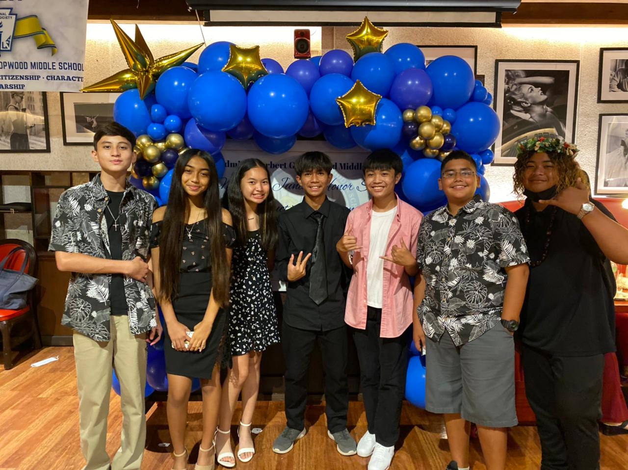 Hopwood Middle School National Junior Honor Society officers Zack I. Camacho, Kianna Rae Palacios, Frances Louise D. Hernandez, Mark Ryan Costales,  James Mercader, Hayden Romeo Igisomar, and Damien Alfred S. Santos