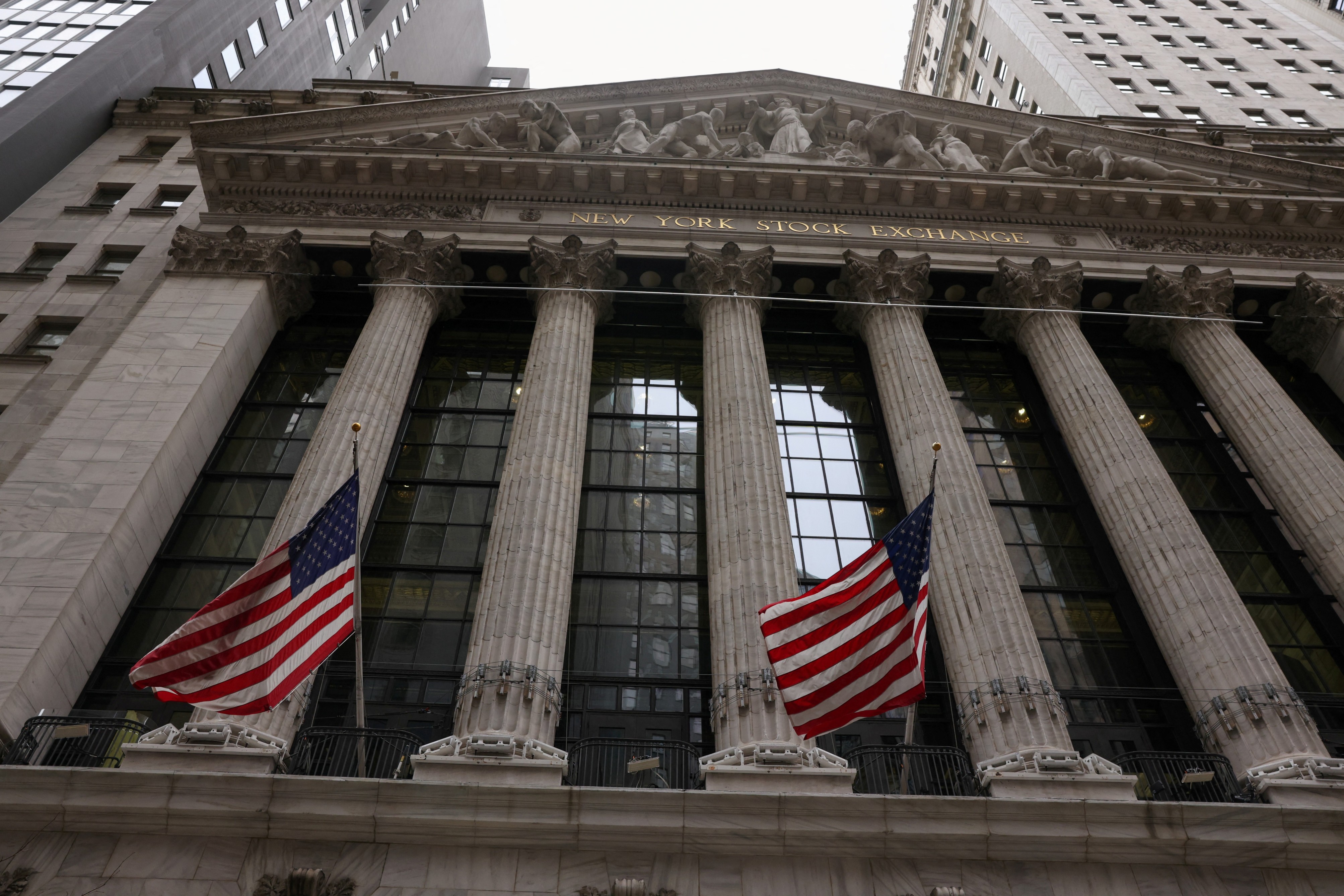 Flags are seen outside the New York Stock Exchange in New York City on Feb. 24, 2022.