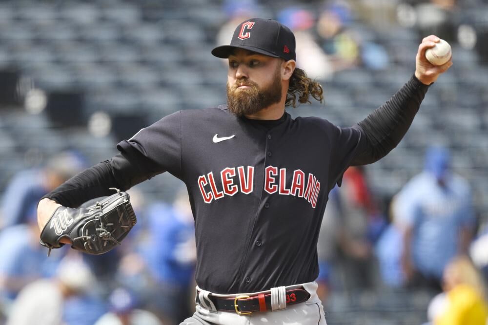 Cleveland Guardians relief pitcher Logan Allen throws during the fifth inning of a baseball game against the Kansas City Royals, Monday, in Kansas City, Mo.