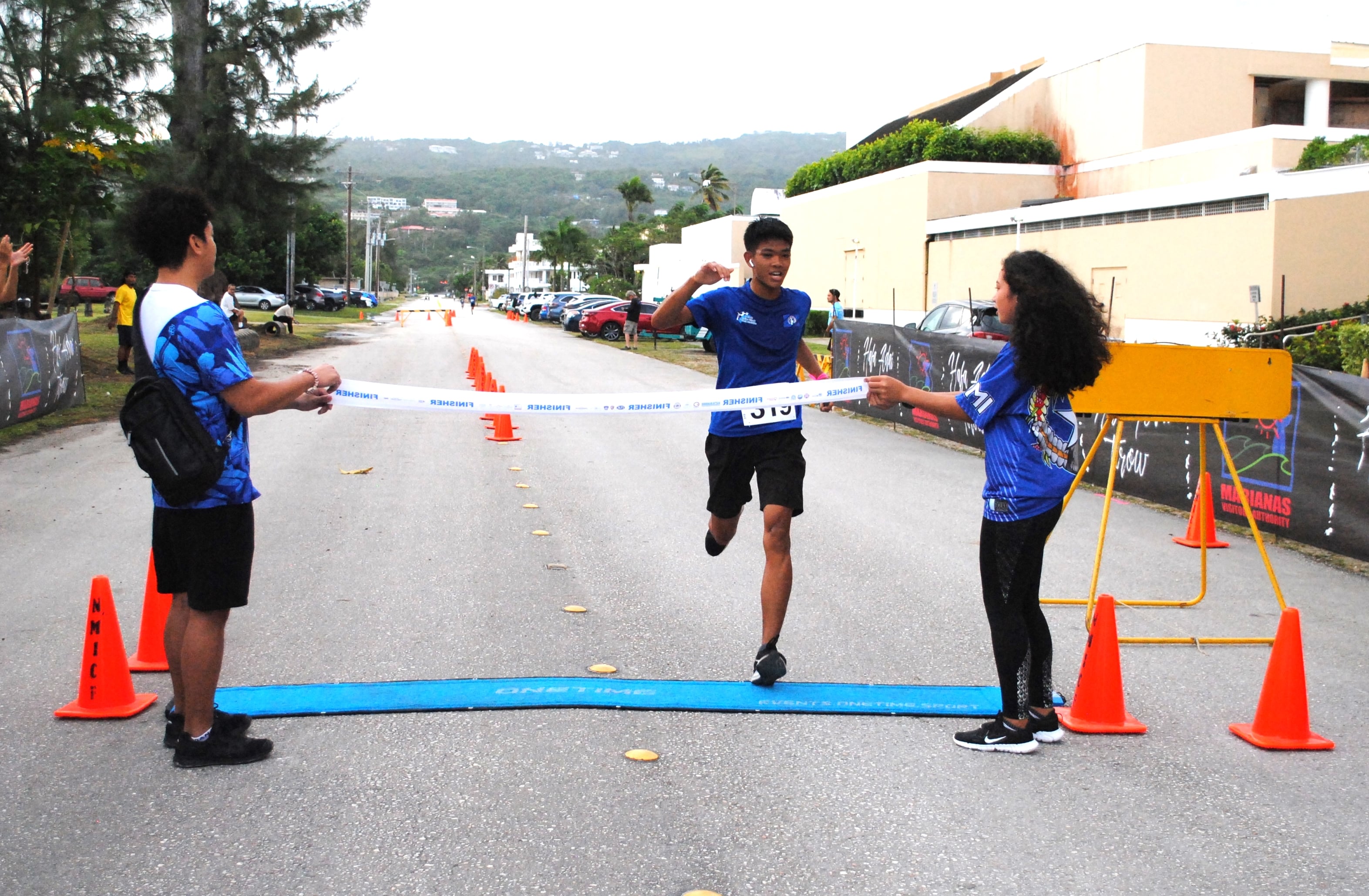 Cody Shimizu finishes first in the Saipan Half Marathon/5K race Saturday at  American Memorial Park.