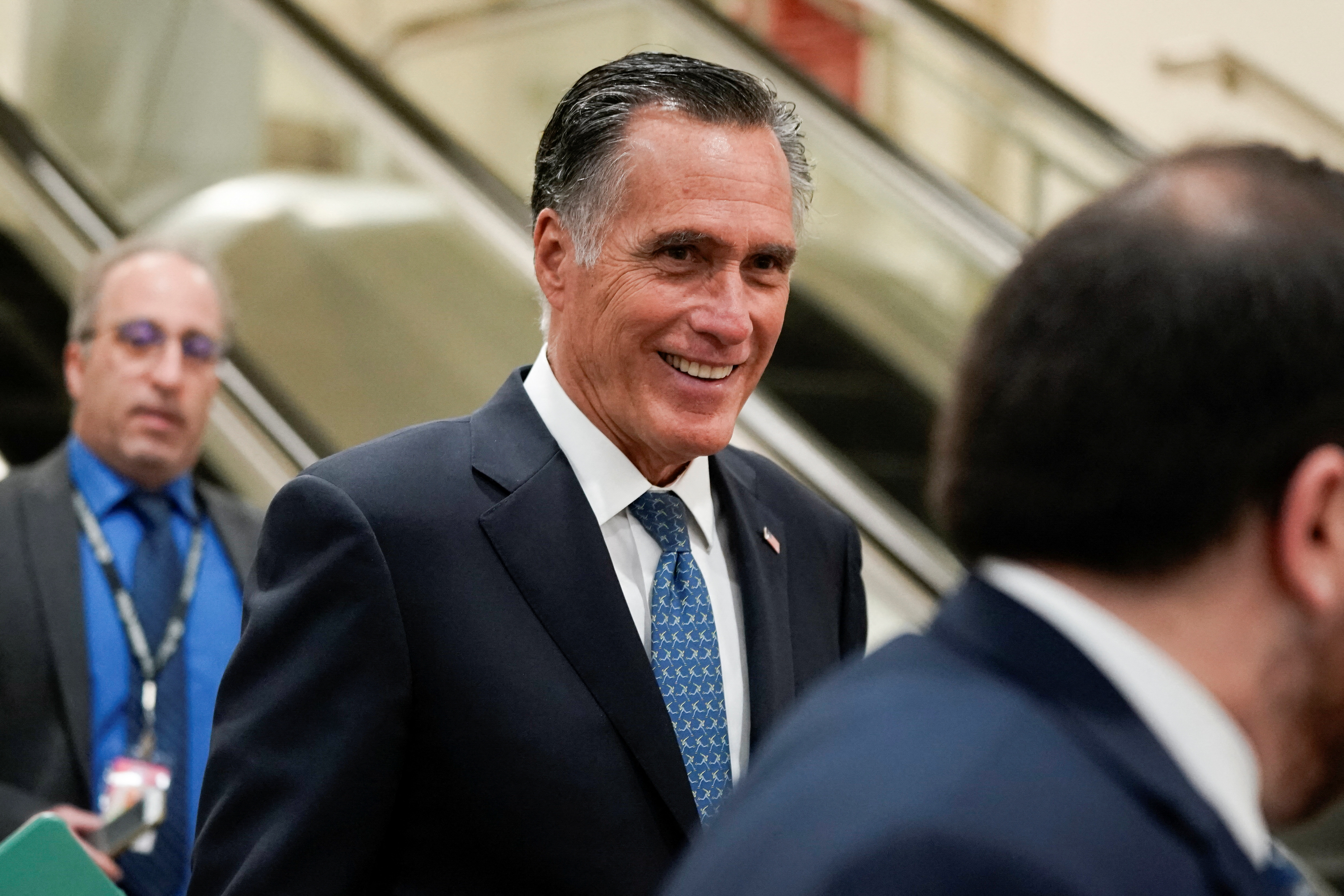 U.S. Sen. Mitt Romney, R-Utah, walks through the Senate subway on his way to a security briefing for senators on Capitol Hill in Washington, D.C., March 30, 2022.