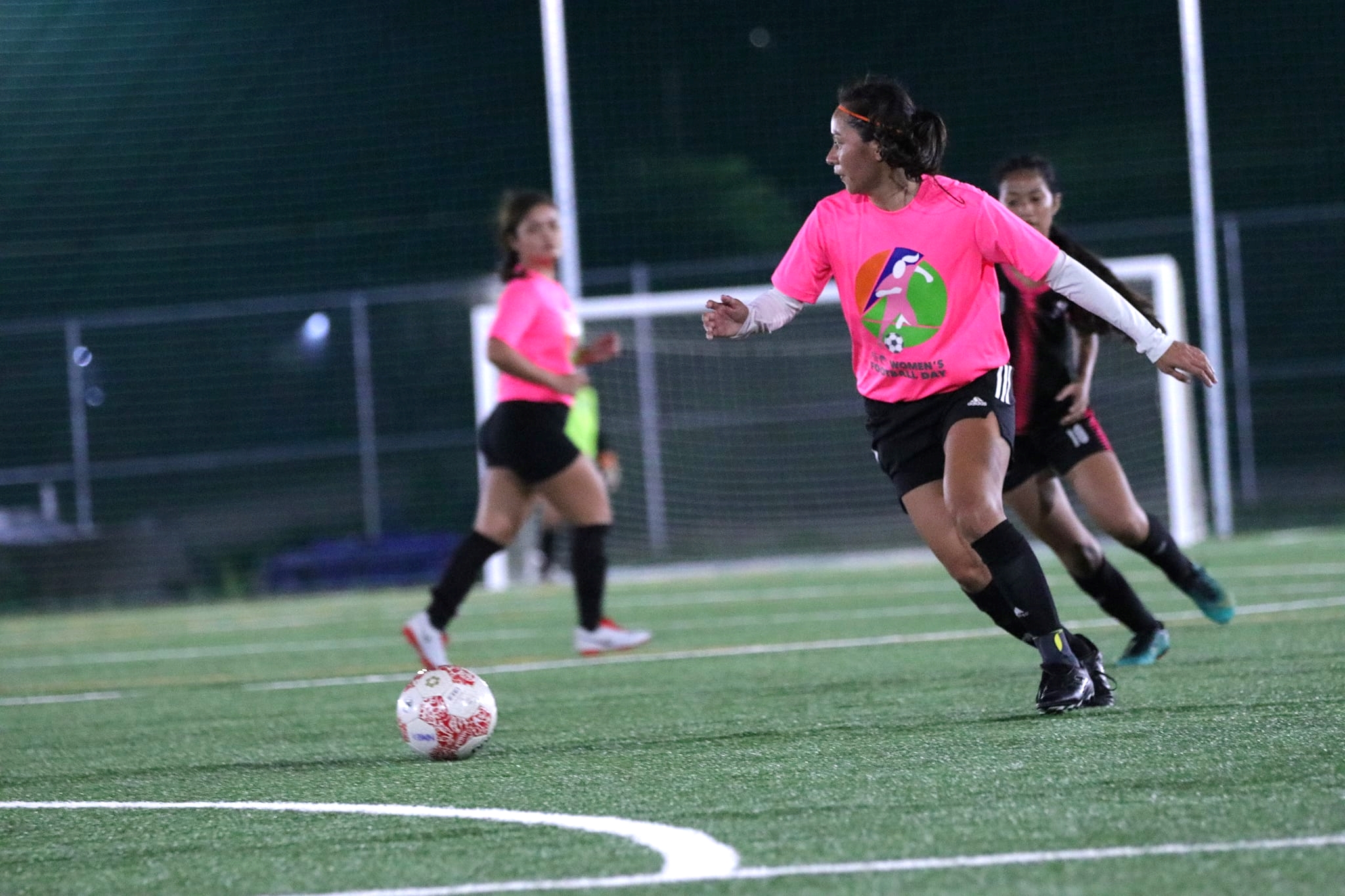 TakeCare's Somia Quan looks on as she gains possession during a Tinekcha-Awall or Premier Division game of the Dove Women's League at the NMI Soccer Training Center.