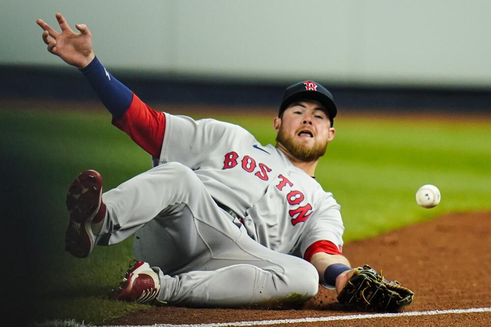 Boston Red Sox's Christian Arroyo fails to catch a ball hit by New York Yankees' Aaron Judge for a single during the third inning of a baseball game Sunday, April 10, 2022, in New York.
