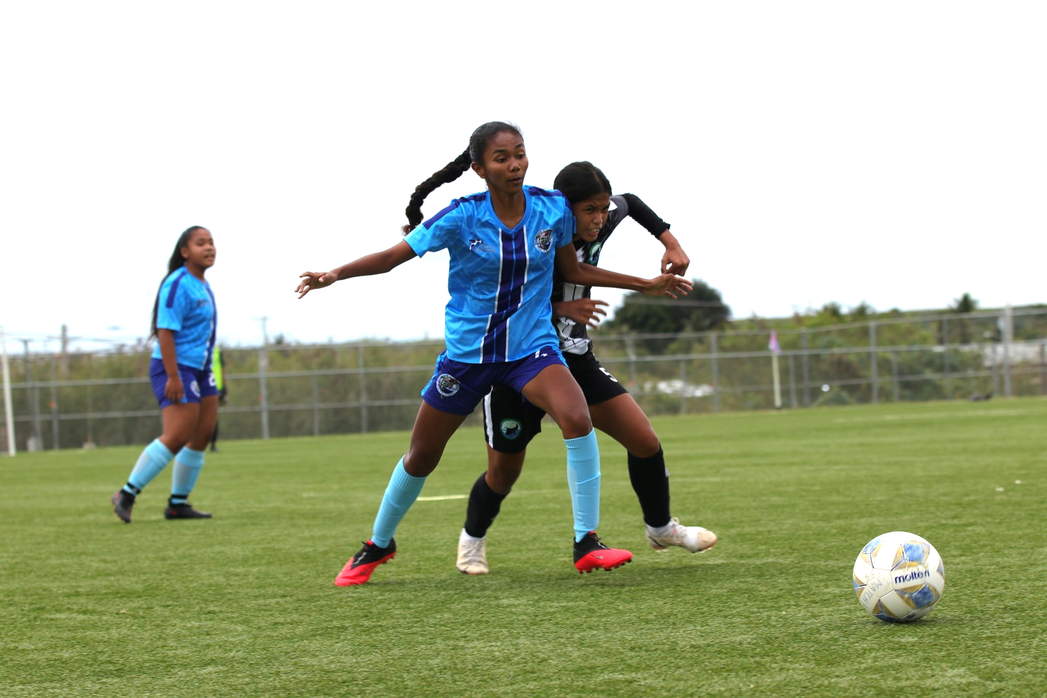 Marianas High School 1's Tyana Kileleman-Hix beats a defender for the possession during a girls high school division game of the NMIFA-PSS Interscholastic Soccer League at the NMI Soccer Training Center.