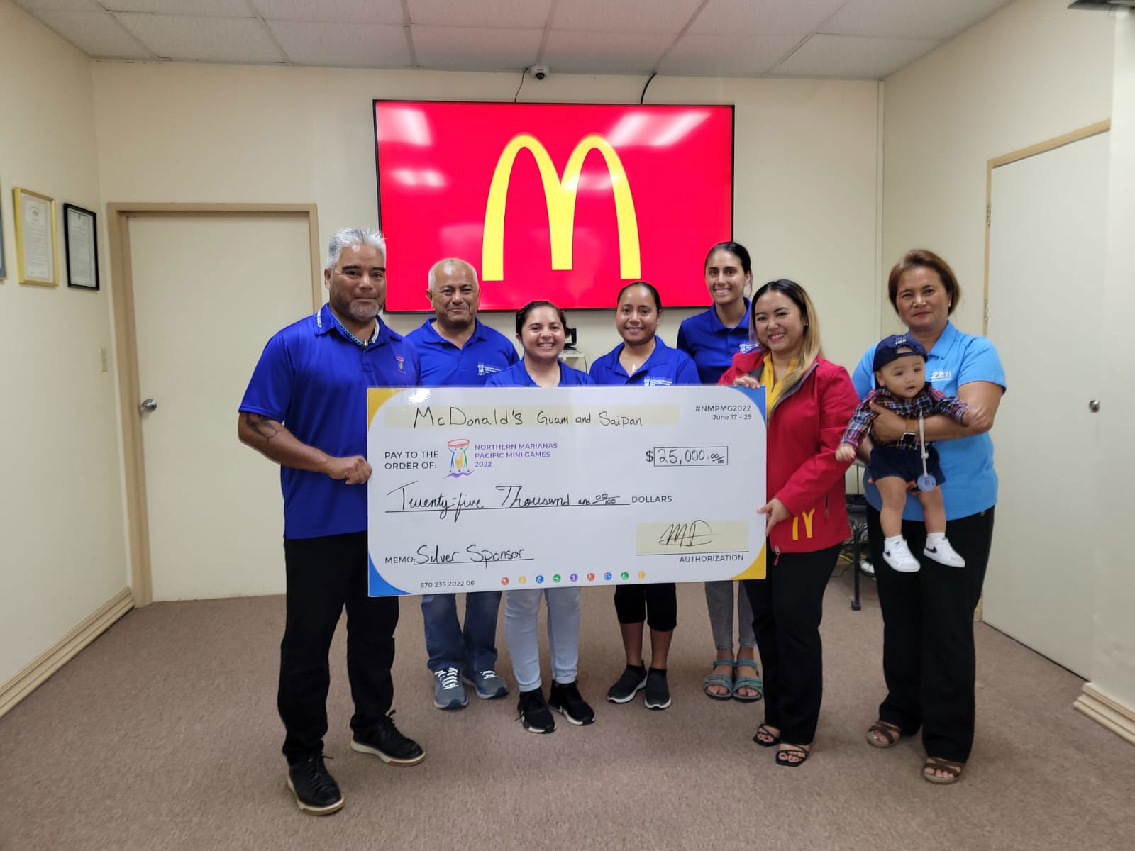 McDonald's Saipan & Guam co-owner/operator Marcia Ayuyu and executive assistant to the president Mable Ayuyu Glenn pose with Pacific Mini Games Organizing Committee Chairman Marco Peter, CEO Ben Babauta and committee members during a presentation of McDonald’s $25,000 donation as a silver sponsor of the 2022 Pacific Mini Games.