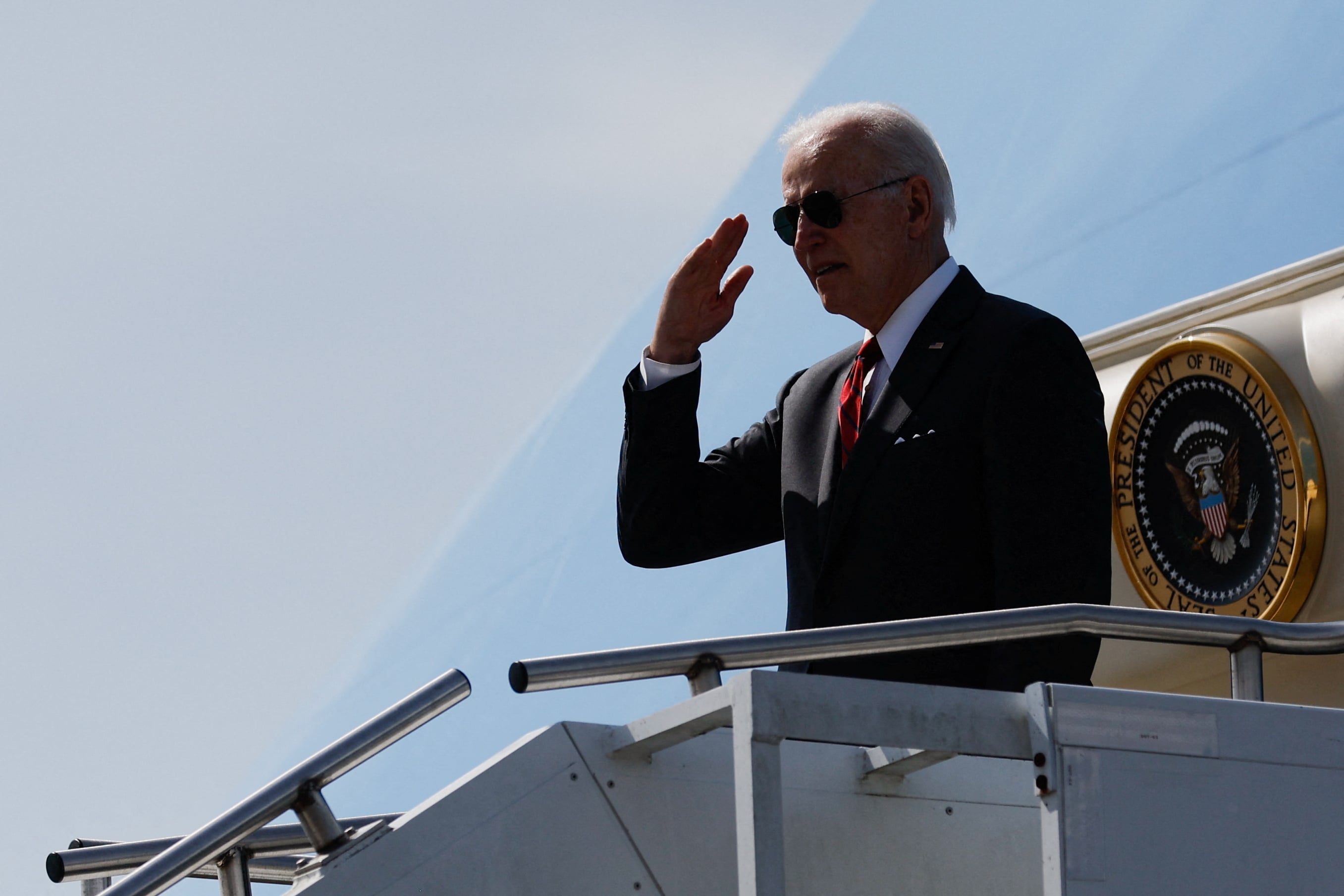 President Joe Biden salutes as he boards Air Force One to return to Washington from Maxwell Air Force Base in Montgomery, Alabama, May 3, 2022.