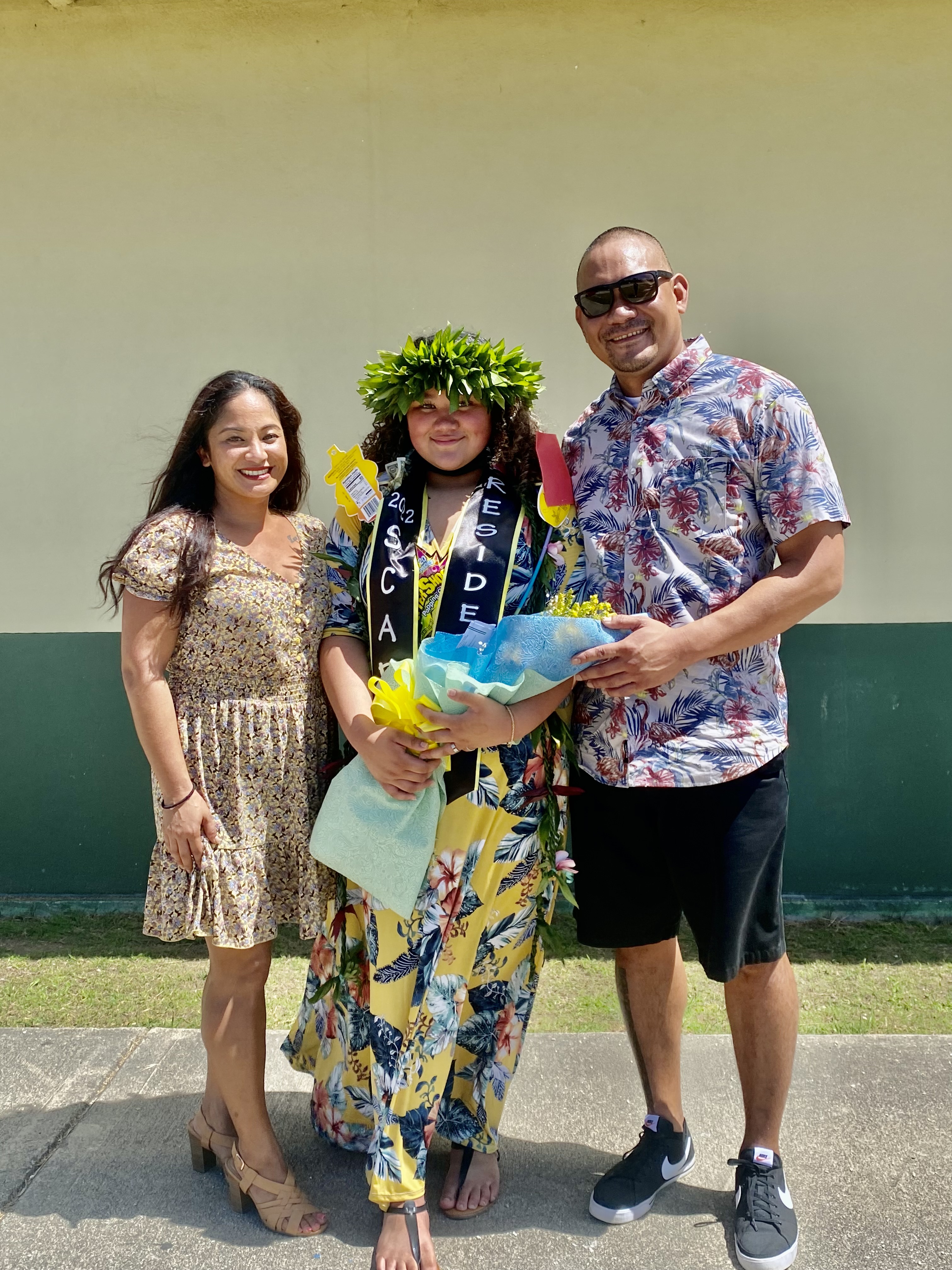 Proud parents Tanya Pangelinan and Adrian Mendiola pose for a photo with their daughter, Monique Mendiola.
