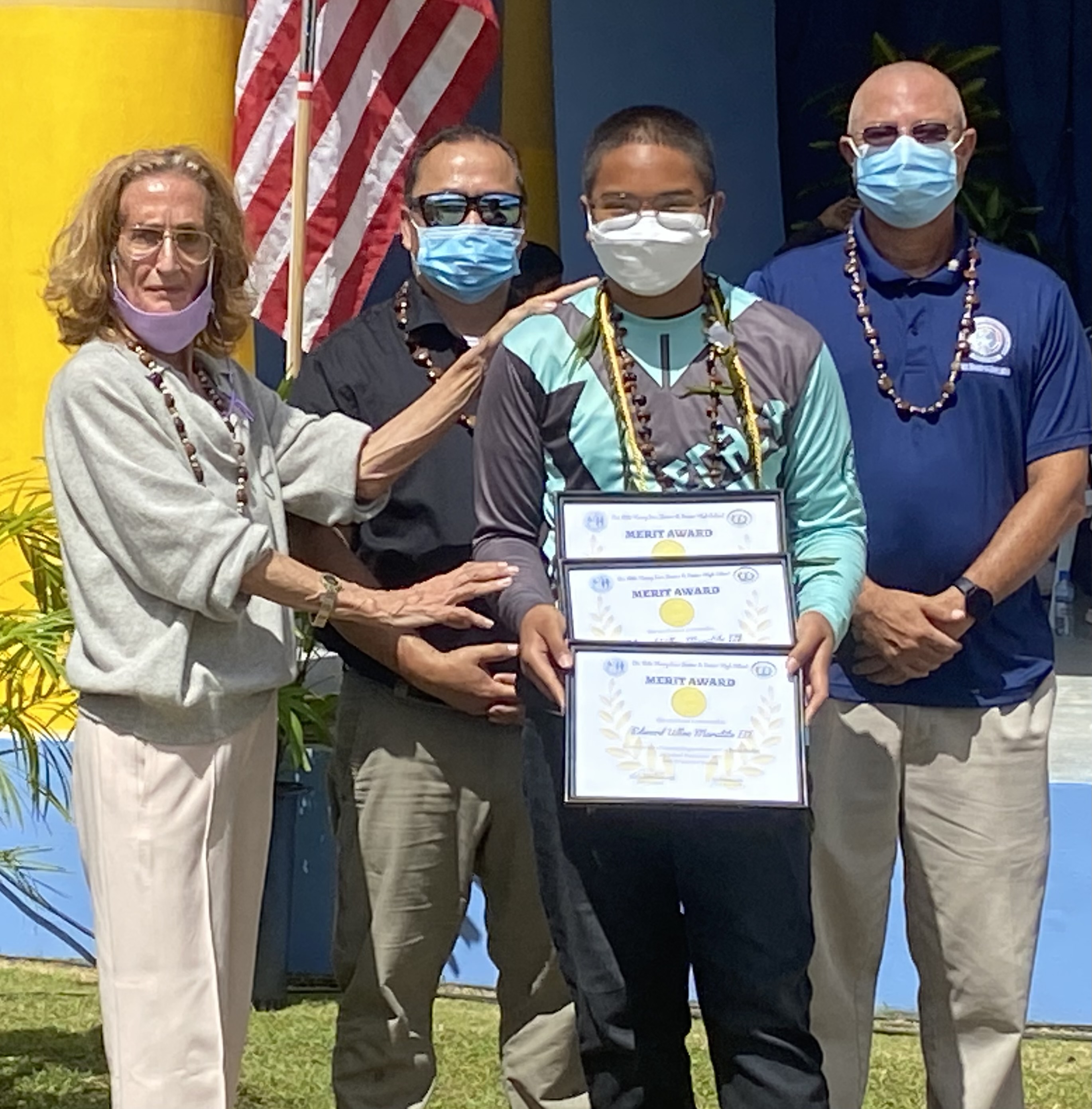 Newly promoted Edward Ulloa Maratita III is presented with the subject awards for Social Studies, Leaderships Corps and Physical Education
