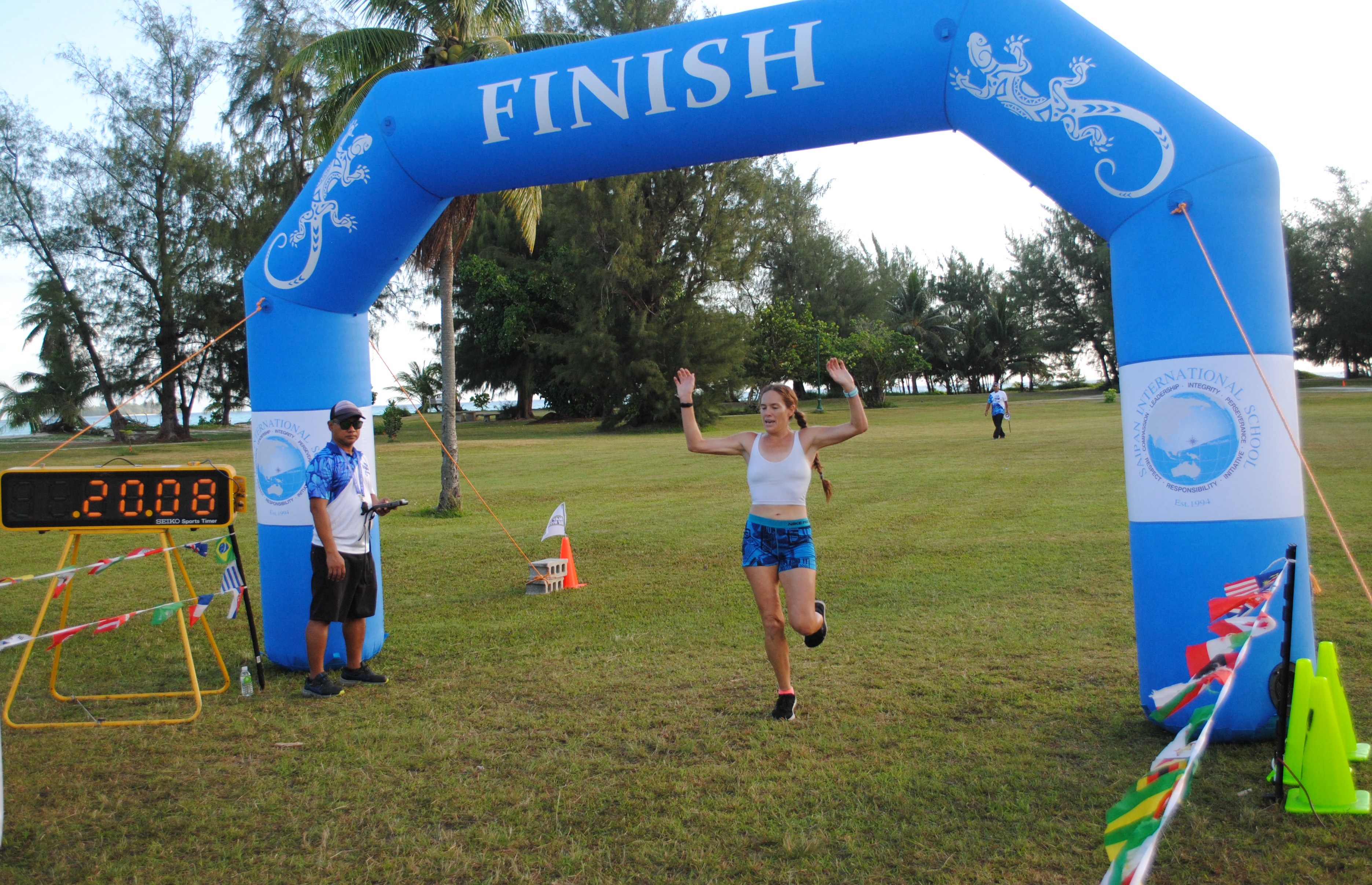 Denise Myers crosses the finish line of the 2nd CNMI Star Wars Day Run on Saturday morning at American Memorial Park.