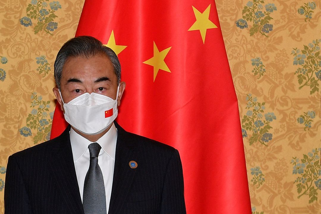 Chinese Foreign Minister Wang Yi poses for a picture prior to meeting U.S. Secretary of State Antony Blinken on the sidelines of the G20 summit in Rome, Italy on Oct. 31, 2021.