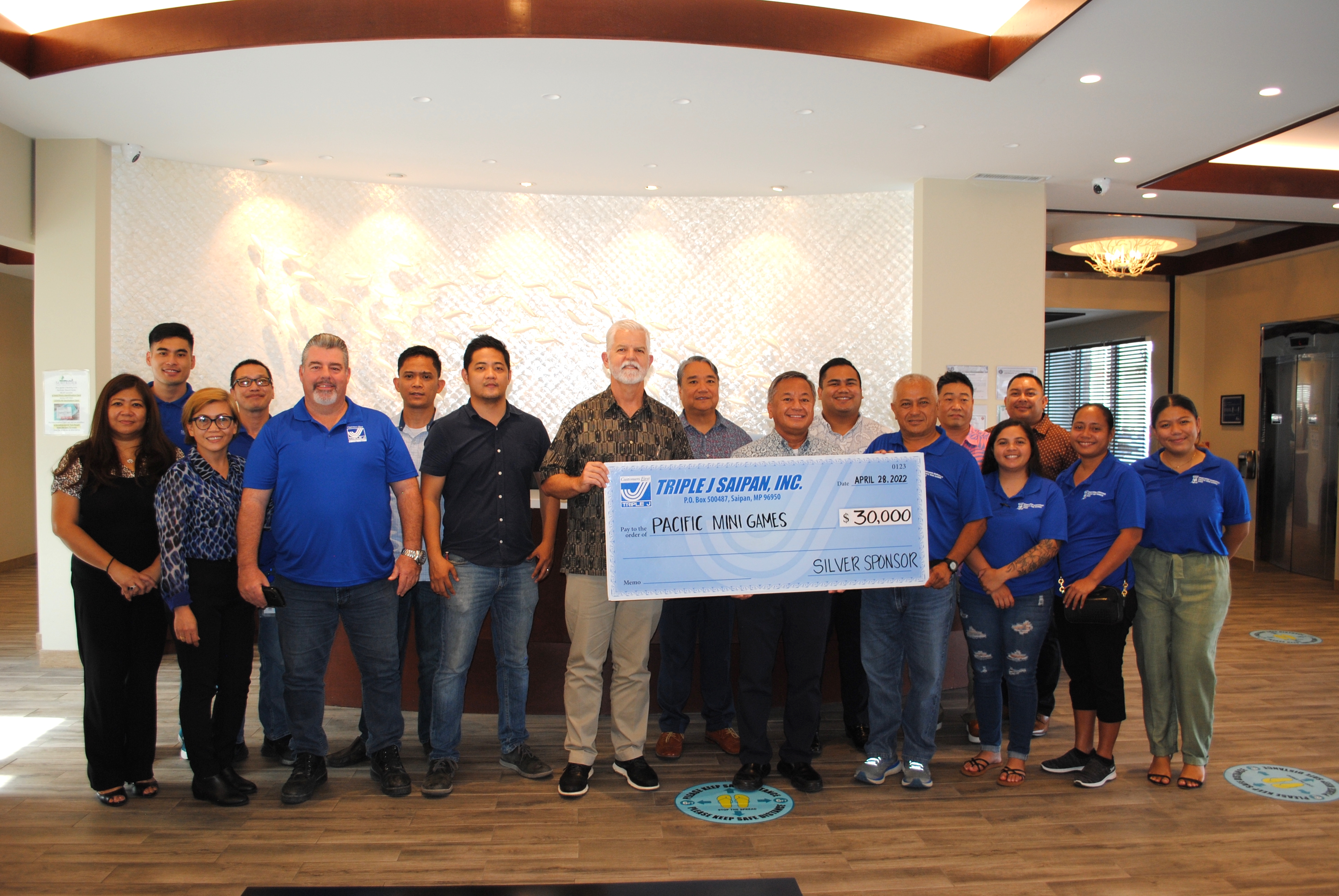 Triple J Saipan has donated $30,000 to the organizing committee of the 2022 Pacific Mini Games which the CNMI will host next month. In photo: Alexander Camacho,  store manager, Payless SuperFresh and Truckload Store; Rachel Roque, real estate, property manager; Mario Valentino, construction superintendent; Carol Lucenara, restaurant manager, Great Harvest Bread Co.; Keith Ahn, general manager, Surfrider Resort Hotel; Jeff Jones, president/COO Triple J Enterprises; Francisco S. Ada, director of human resources, Triple J Saipan; Fred Camacho, business development manager; Mike S. Sablan, vice president & finance, Triple J Enterprises Inc.; Jose S. P. Mafnas Jr., corporate legal counsel; Ian Obnimaga, accounting manager; Ringo Medina, general manager, Surf Club Restaurant; Pacific Mini Games organizing committee CEO Ben Babauta and some of his team members.