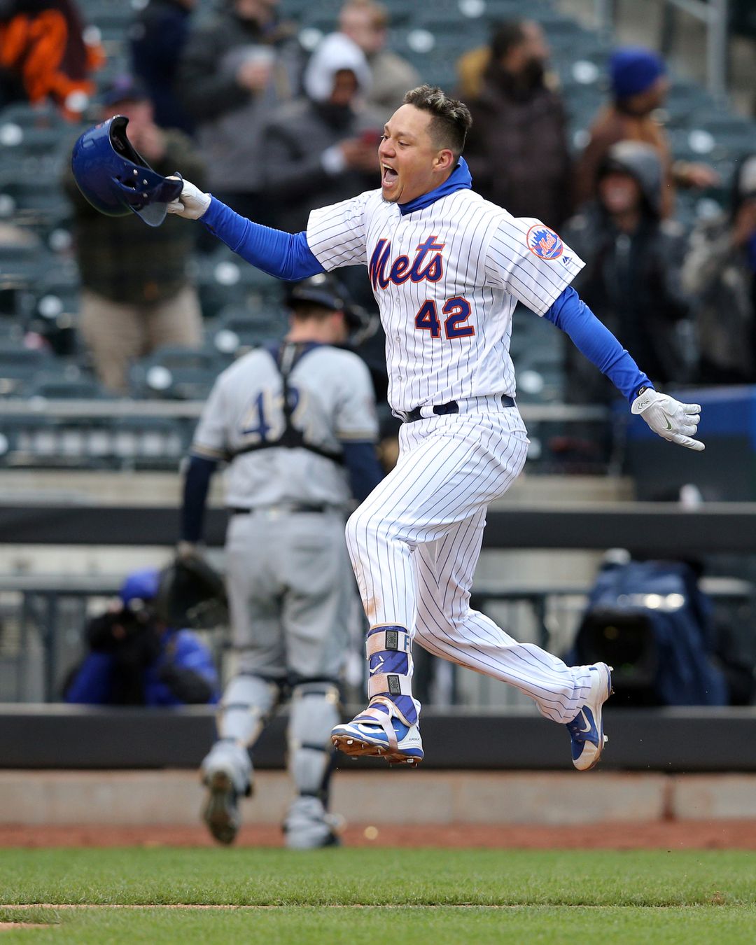 New York Mets first baseman Wilmer Flores celebrates after hitting a walk off solo home run against the Milwaukee Brewers during the ninth inning at Citi Field in New York City on April 15, 2018.