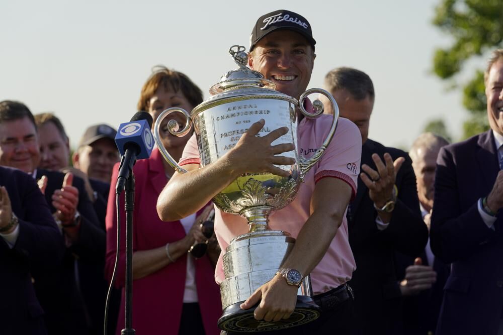 Justin Thomas holds the Wanamaker Trophy after winning the PGA Championship golf tournament in a playoff against Will Zalatoris at Southern Hills Country Club, Sunday, May 22, 2022, in Tulsa, Okla.